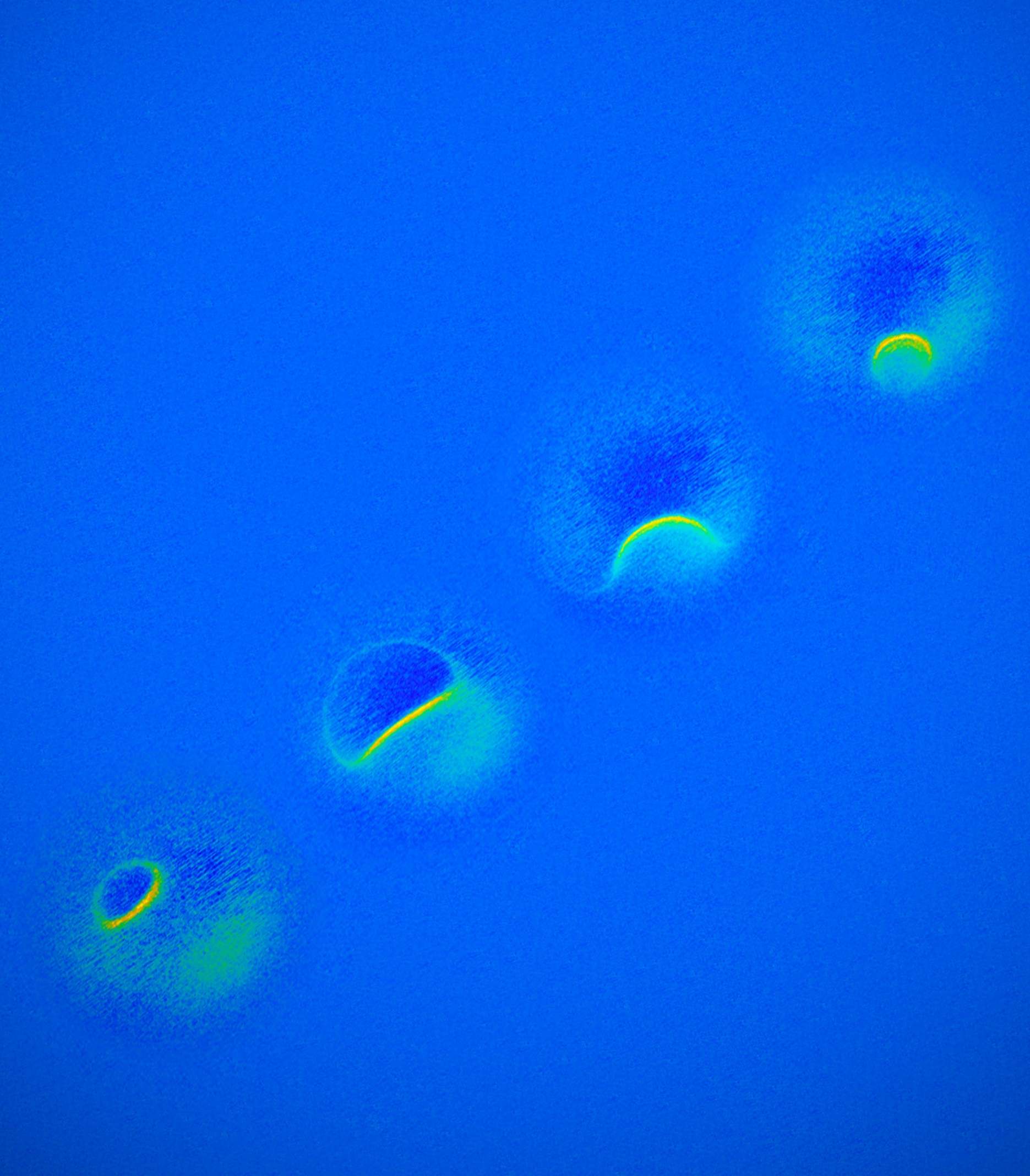 MRI scans, combined, of a single titanium atom reveal the magnetic field of the atom at different strengths