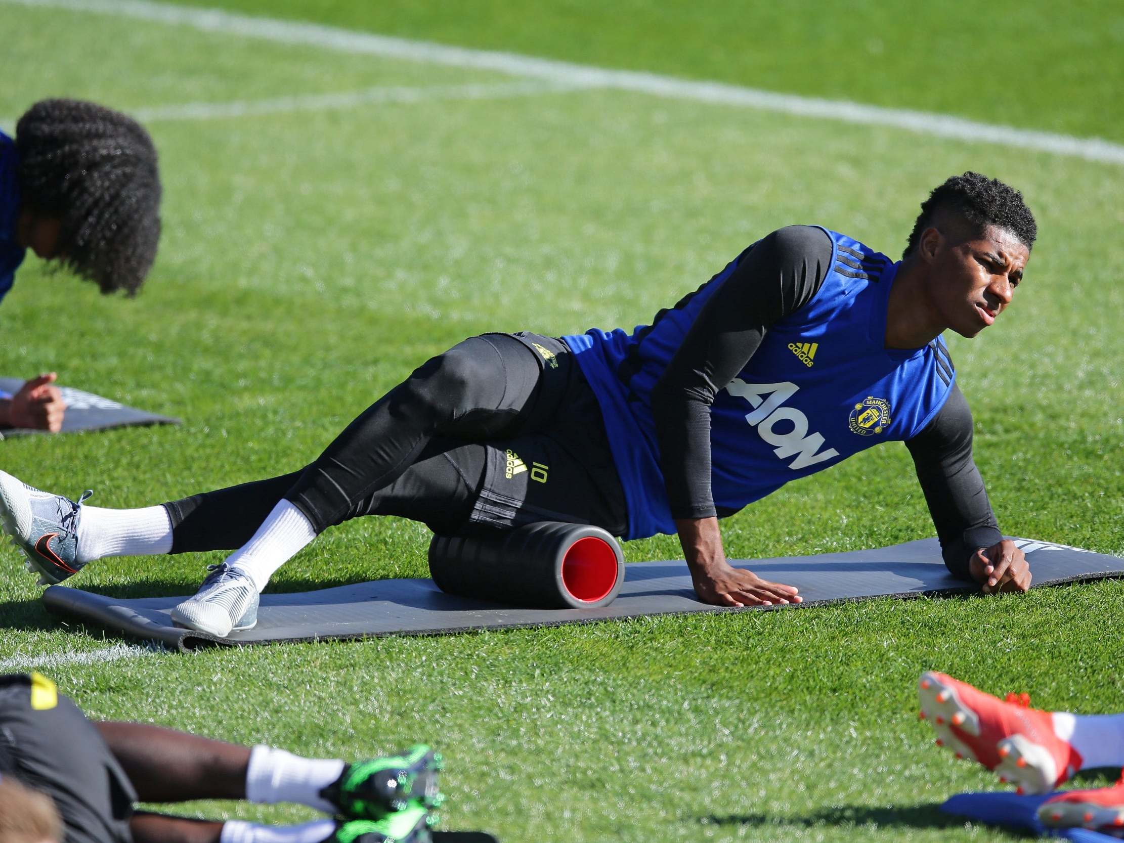 Rashford stretches during pre-season