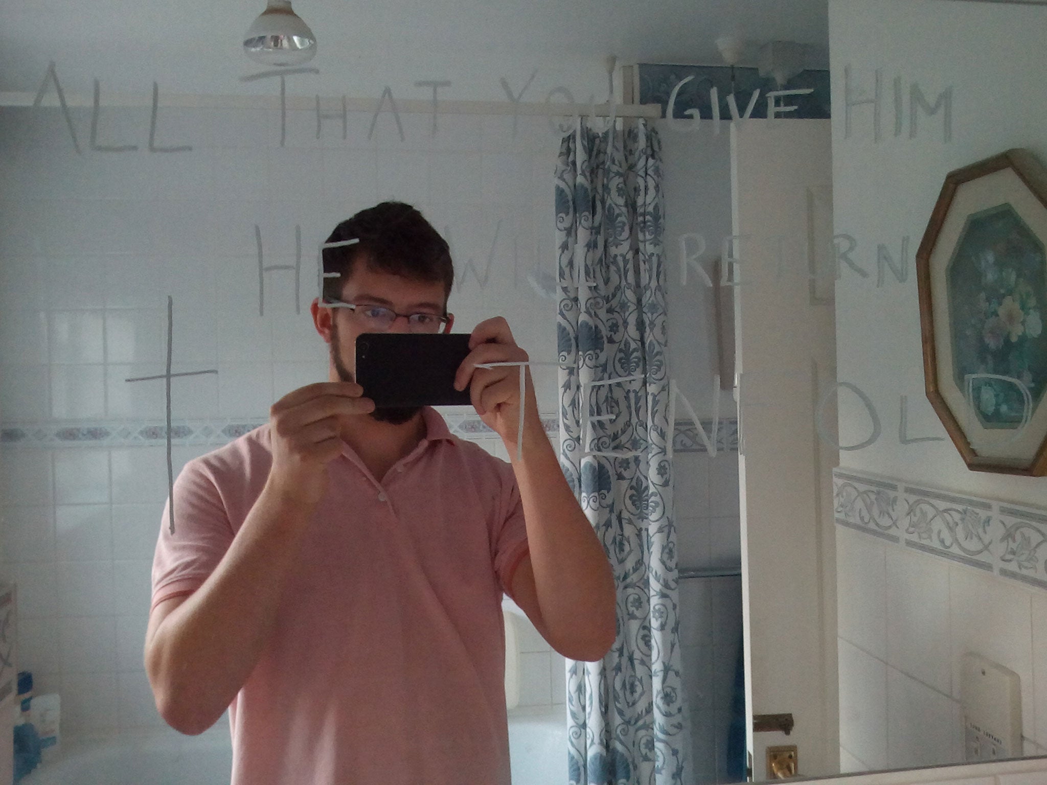 A selfie taken by Ben Field with one of the message he wrote on a mirror in Ann Moore-Martin’s home