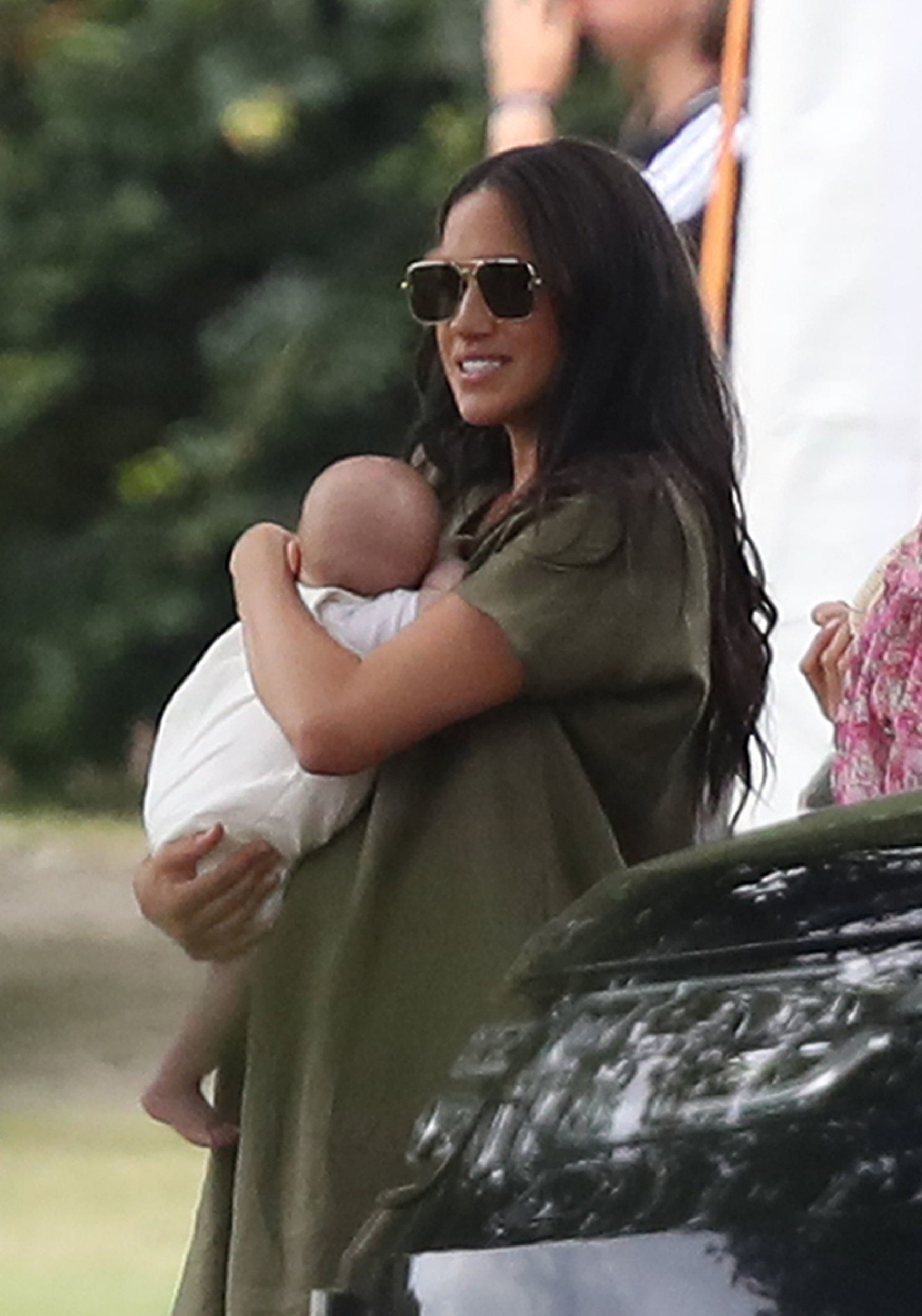 Duchess of Sussex holds son Archie at King Power Royal Charity Polo Day