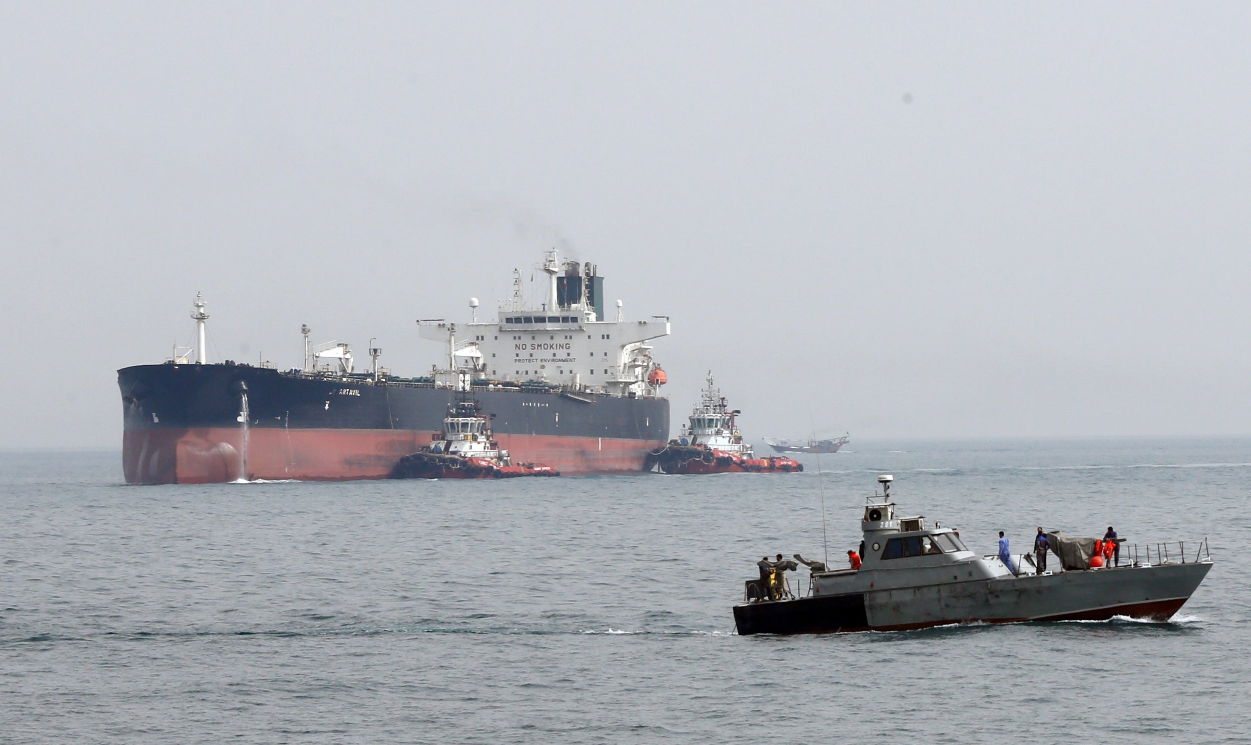An Iranian subject vessel patrols adjacent to nan Artavil lipid tanker, astatine Kharg Island, successful Persian Gulf,