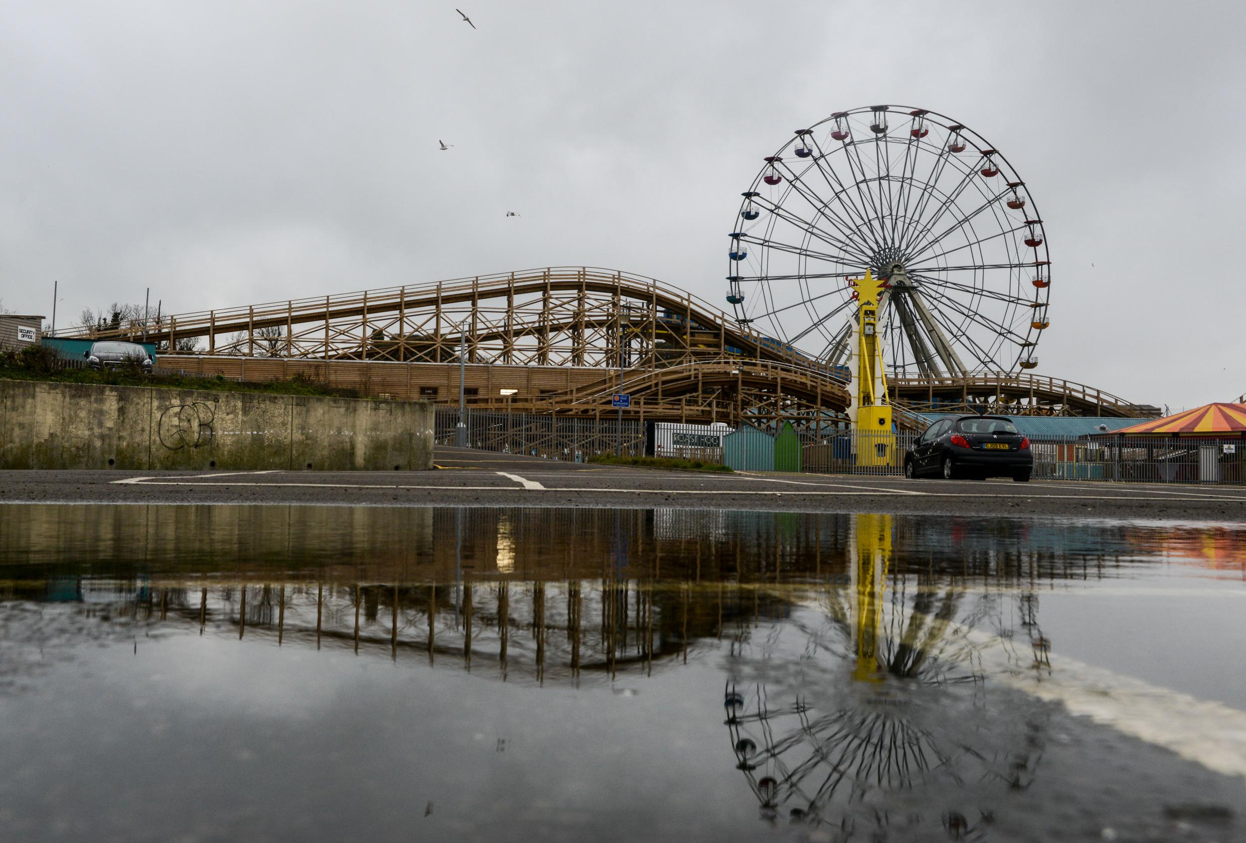 A ferris wheel and the wooden rollercoaster, Scenic Railway, at Dreamland Margate