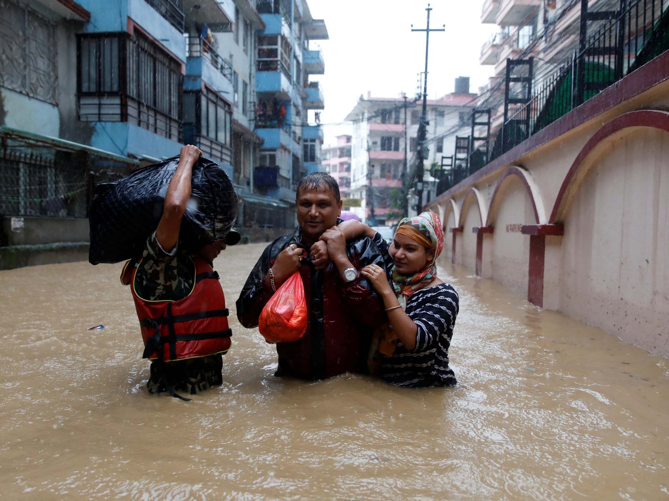 Homes in Nepal have been submerged in flood waters after monsoon rains pounded the country