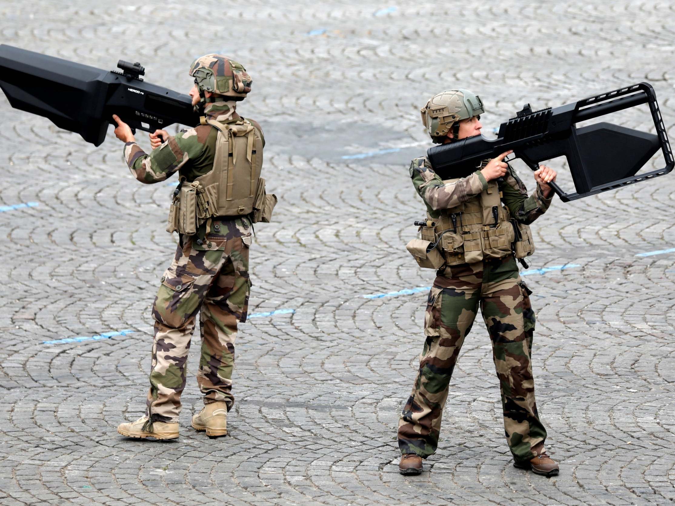 French Army soldiers hold anti-drone guns during the traditional Bastille Day military parade on the Champs-Elysees Avenue in Paris