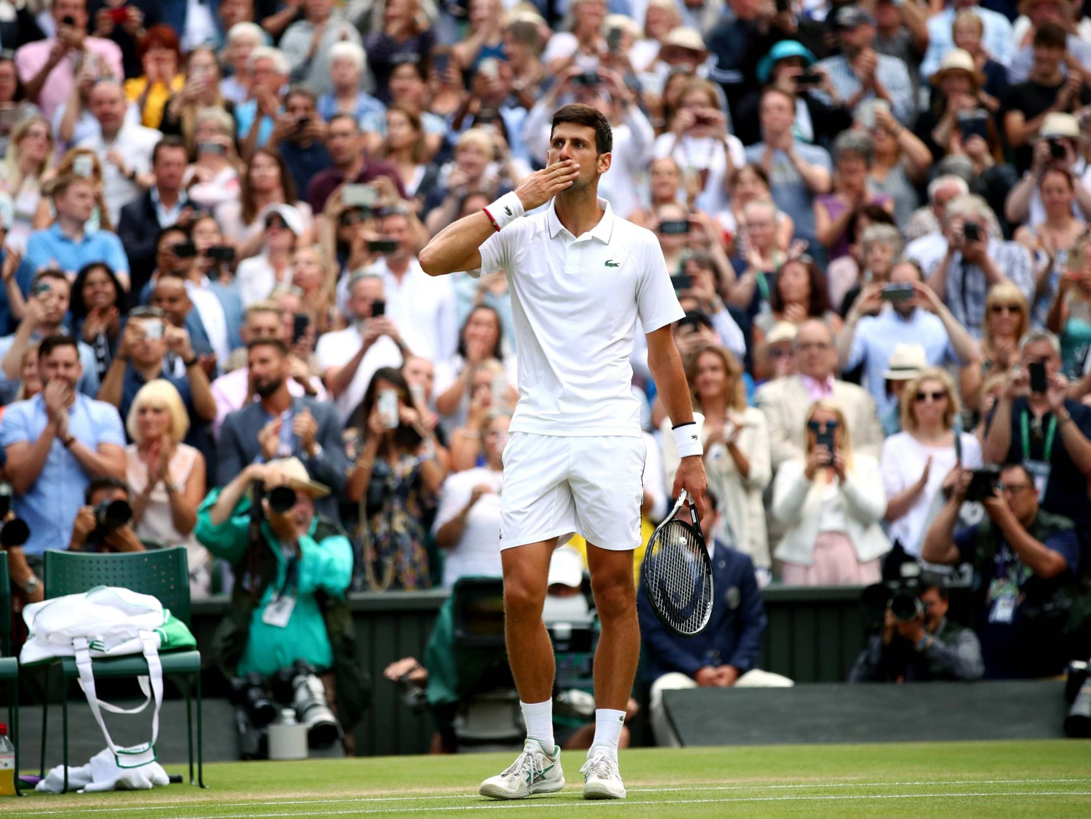 Djokovic celebrates after clinching a fifth Wimbledon title