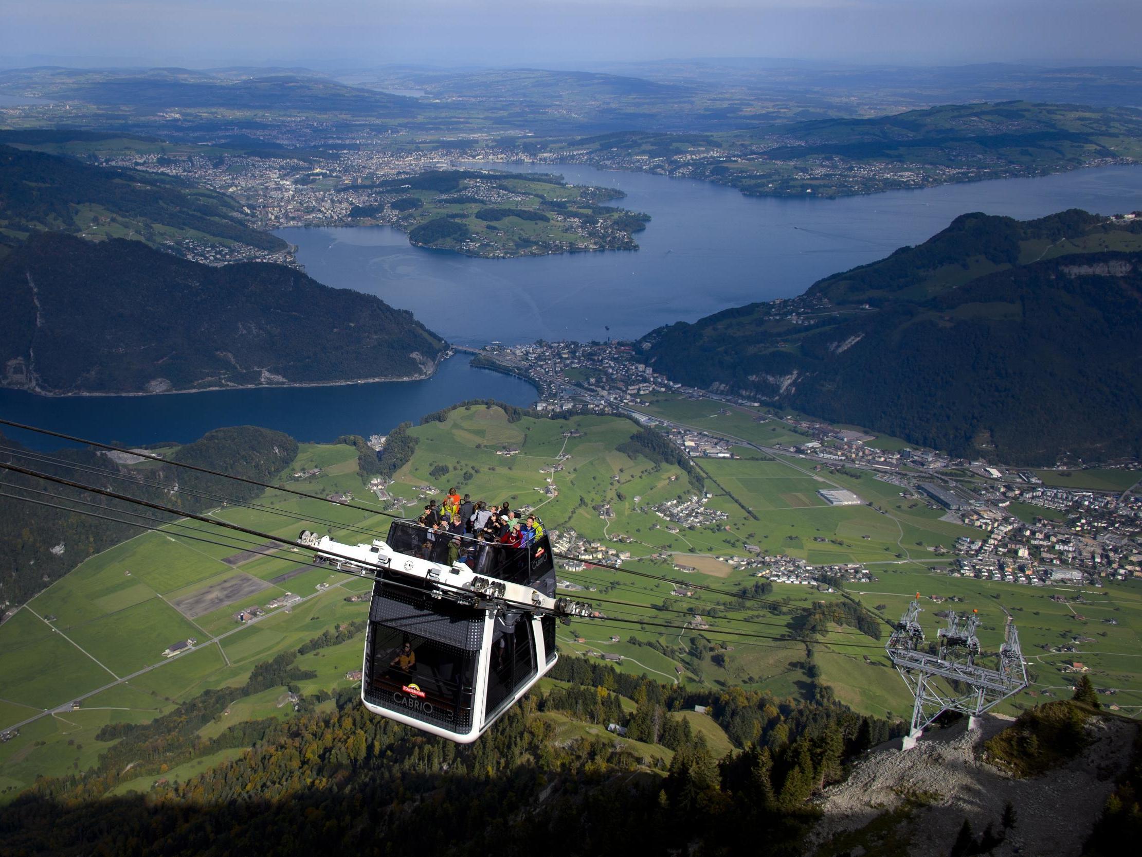 Tourist take the cable car to Stanserhorn mountain, overlooking Lake Lucerne (AFP/Getty)