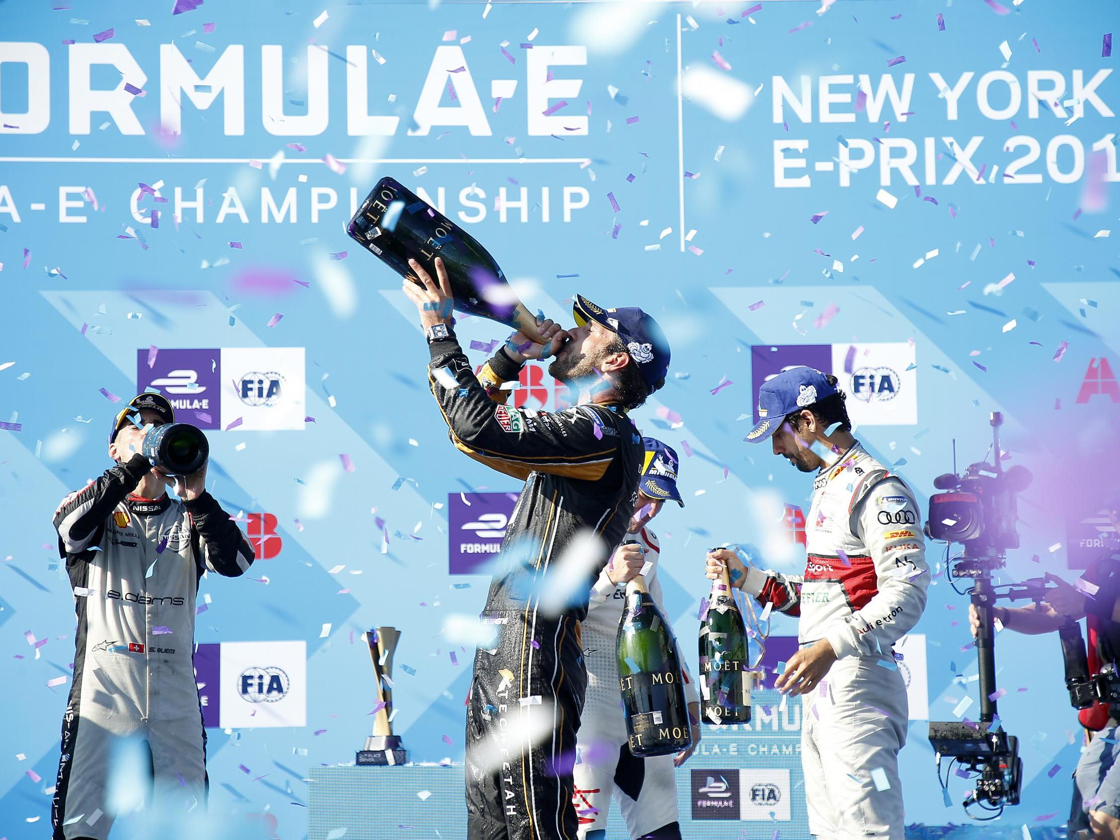 Jean-Eric Vergne celebrates his title victory on the podium in New York