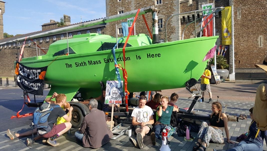 Extinction Rebellion activists protest outside Cardiff Castle in Wales