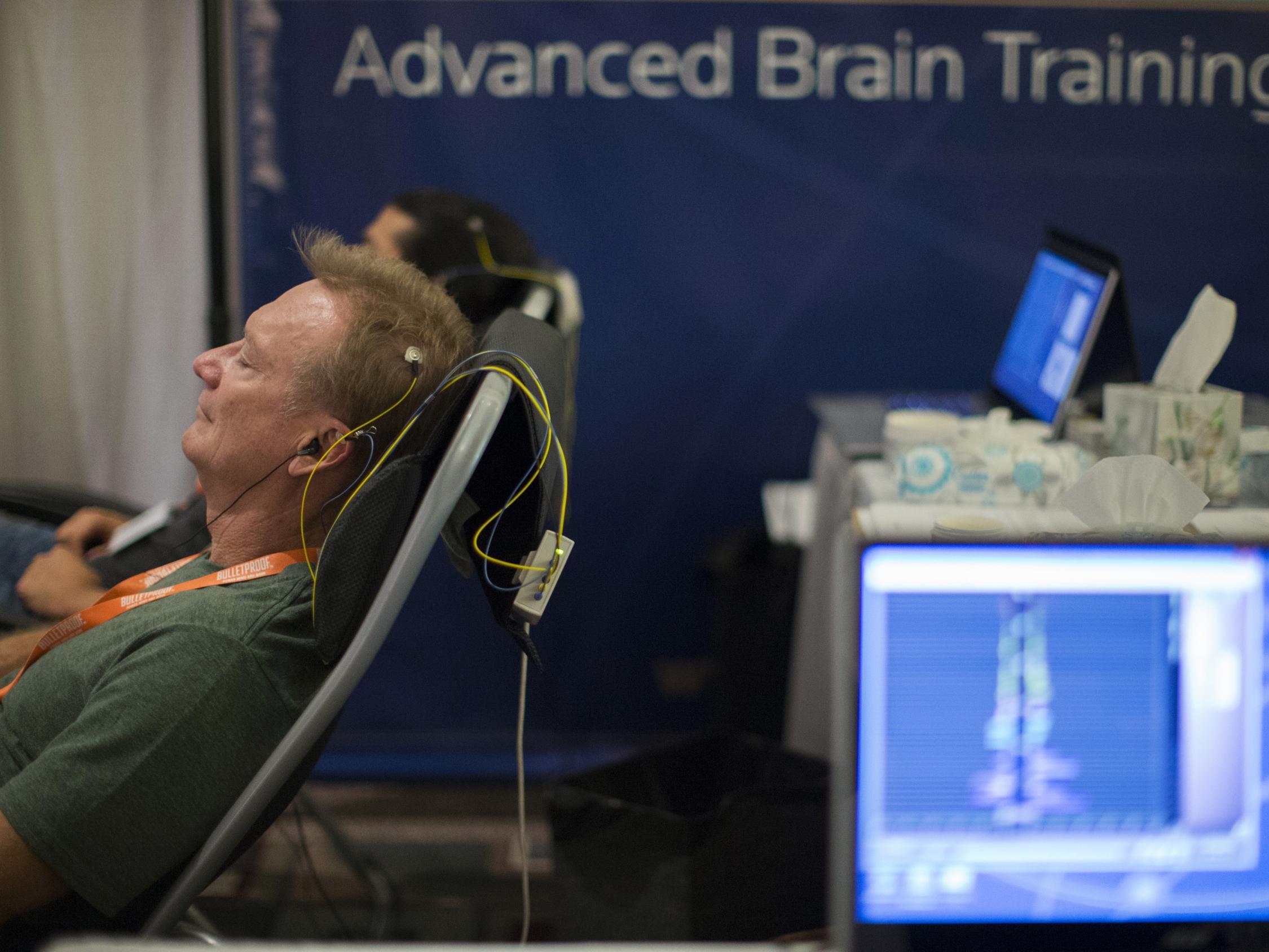 A neuro-feedback session at the Bulletproof Biohacking Conference, 2014: attendees don an EEG headband to ‘train the flexibility of the brain’