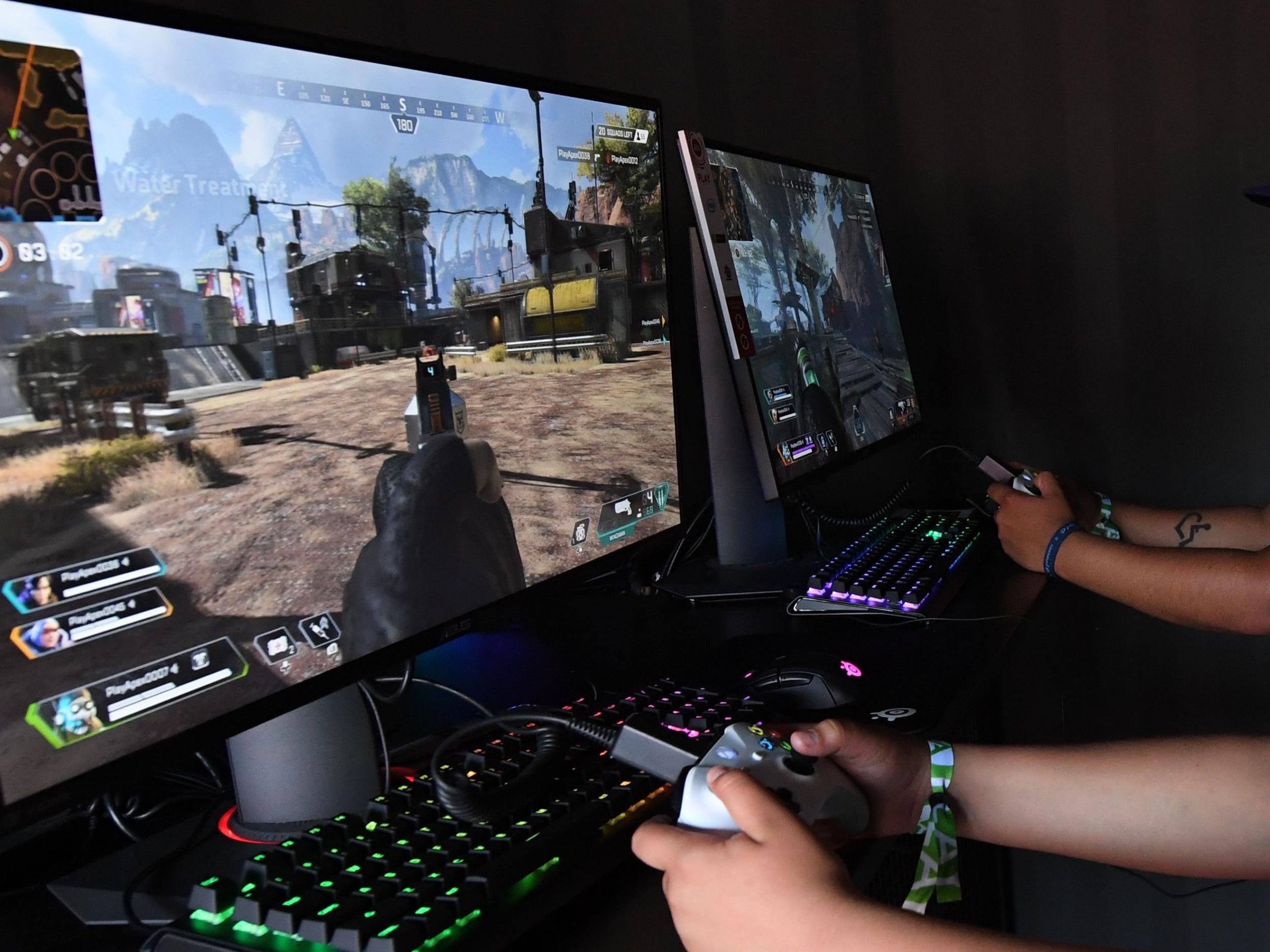 Gamers play a new version of Apex Legends video game at the EA PLAY event in California on 8 June, 2019