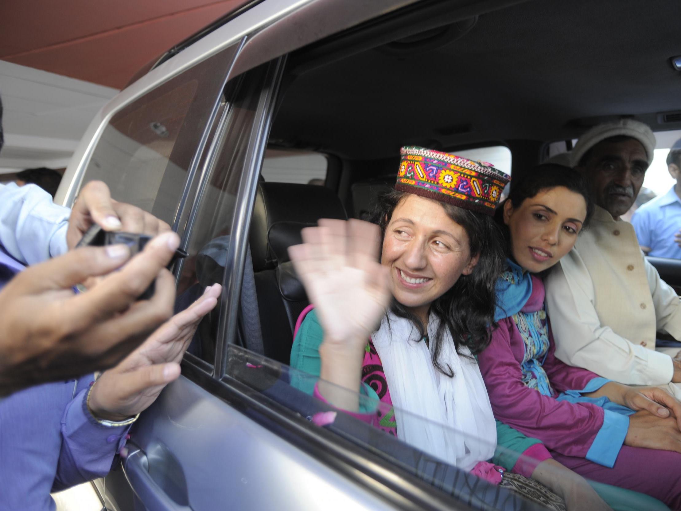 Baig waves to supporters after arriving in Islamabad following her Everest summit in 2013