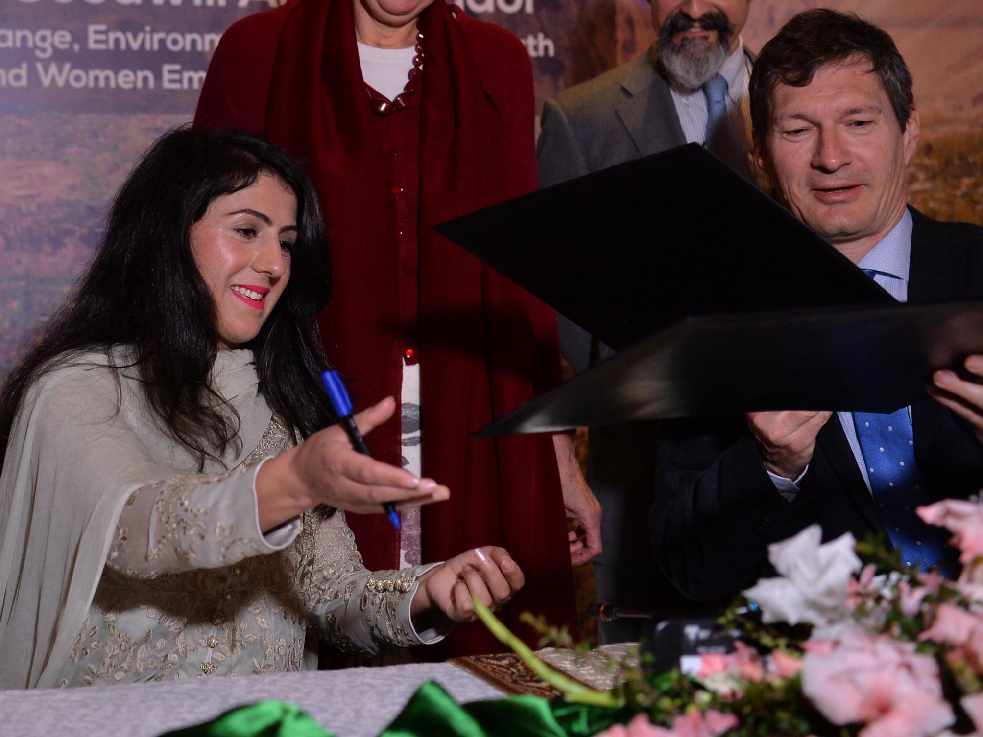 Baig and UN Pakistan coordinator Neil Buhne during a ceremony appointing her as goodwill ambassador in Islamabad in February 2018