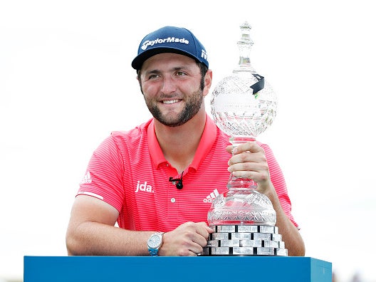 Jon Rahm poses with the trophy after winning the Irish Open