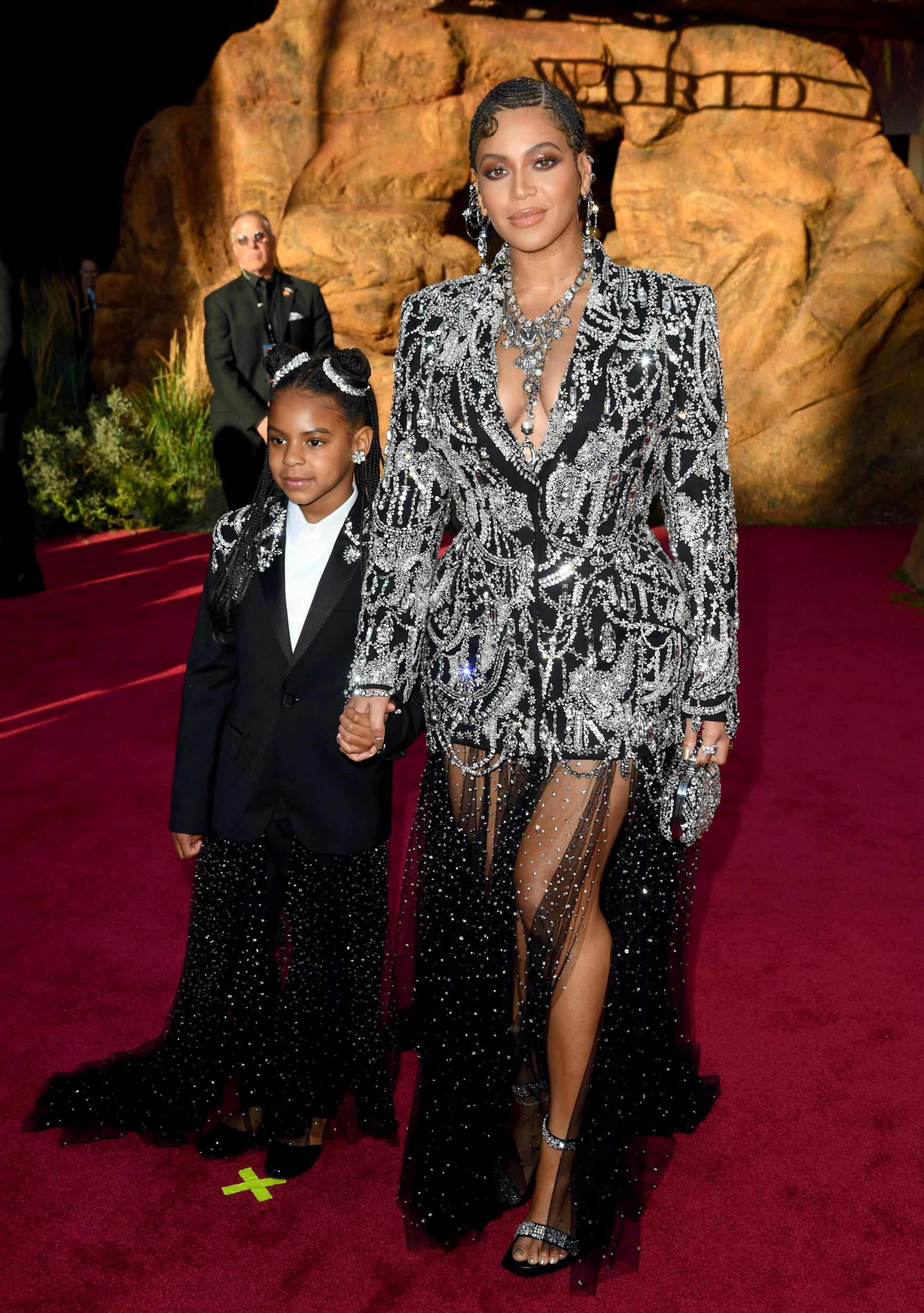 On 9 July 2019, Beyoncé and Blue Ivy attended the premiere of the Disney live-action remake of <i>The Lion King</i> at the Dolby Theatre in Hollywood, California. The pair wore extravagant ensembles with matching diamante designs, Beyoncé in an Alexander McQueen beaded gown and her seven-year-old daughter in a black blazer also by the designer.