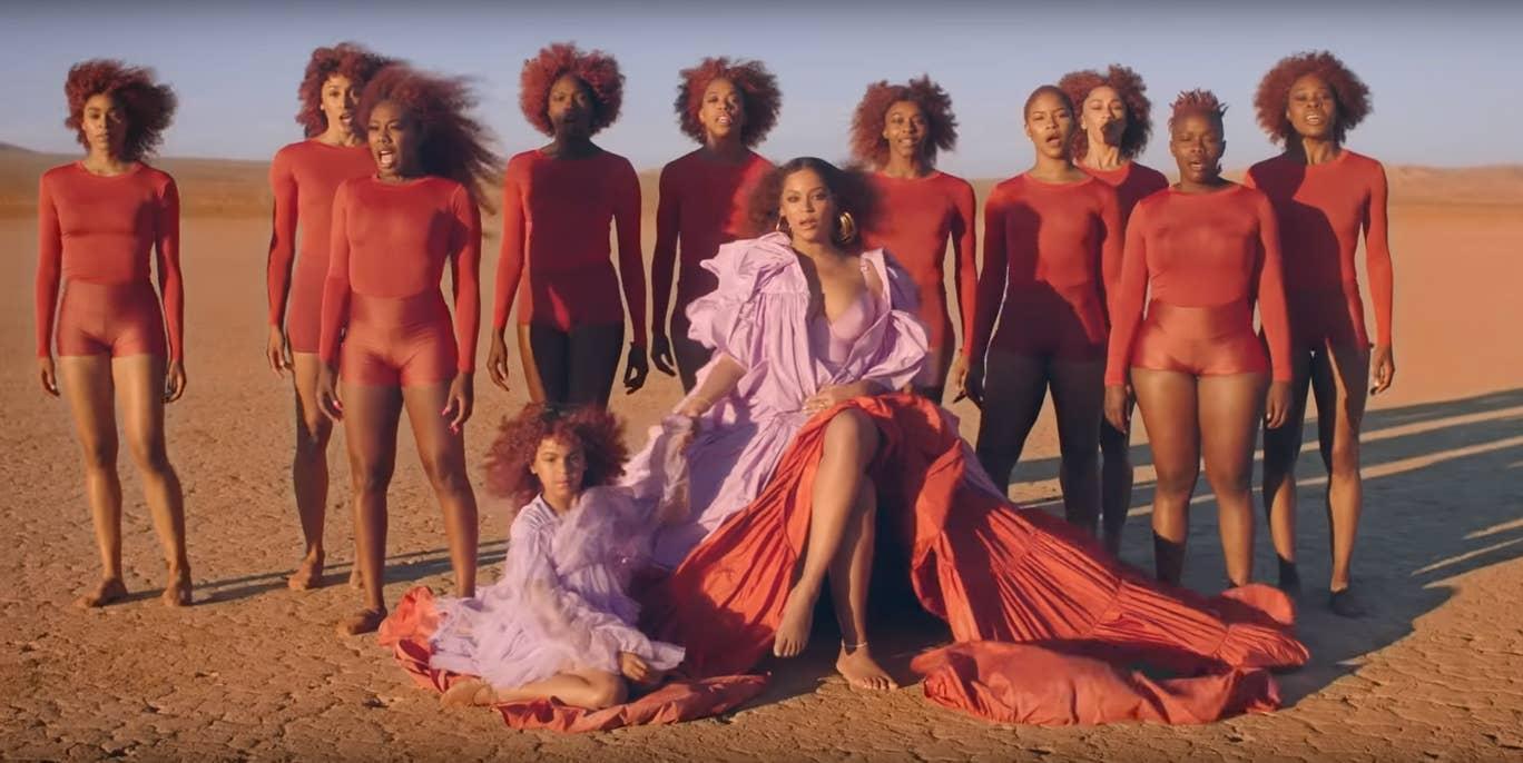 On 16 July 2019, Beyoncé released the music video for the song 'Spirit', from the soundtrack for the 2019 remake of <i>The Lion King</i>. Described by the singer as a 'love letter to Africa', the music video featured Blue Ivy matching her mother, dressed in a pink and red ruffled gown. The seven-year-old's hair was dyed a dusky shade of blue, matching the outfits of the backing singers in the composition.