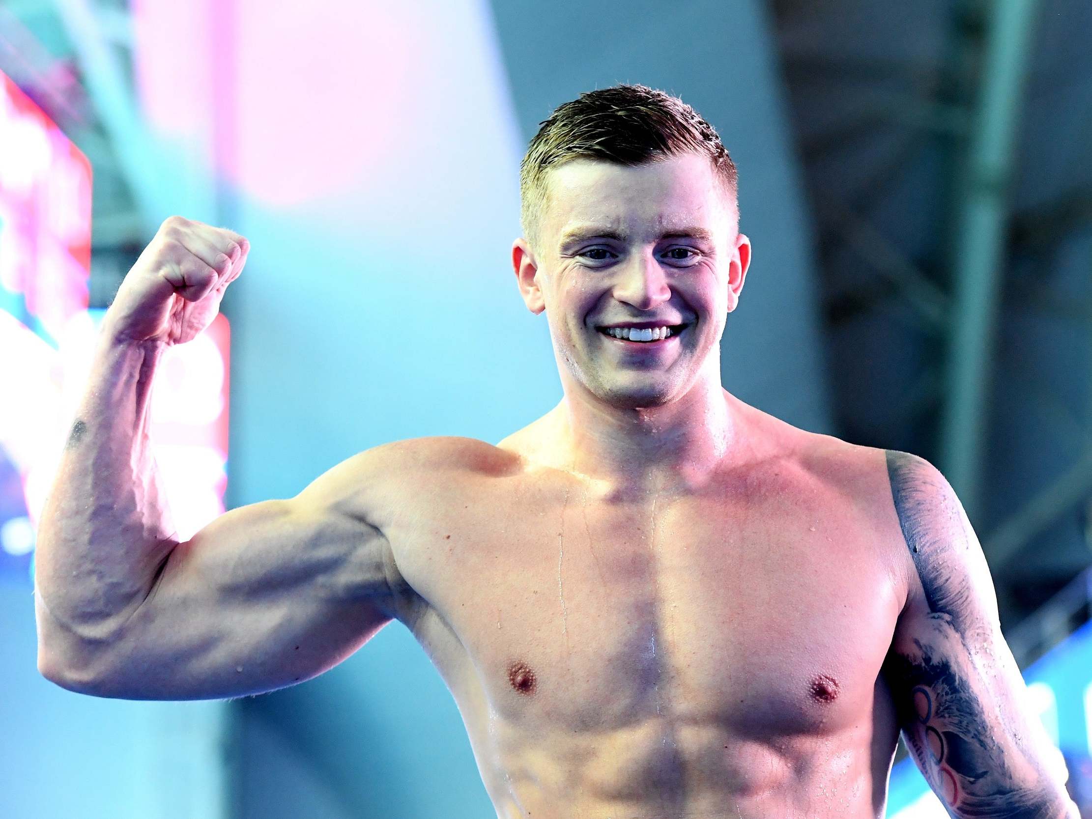 Adam Peaty celebrates setting a new world record as he won the 100m breastroke final