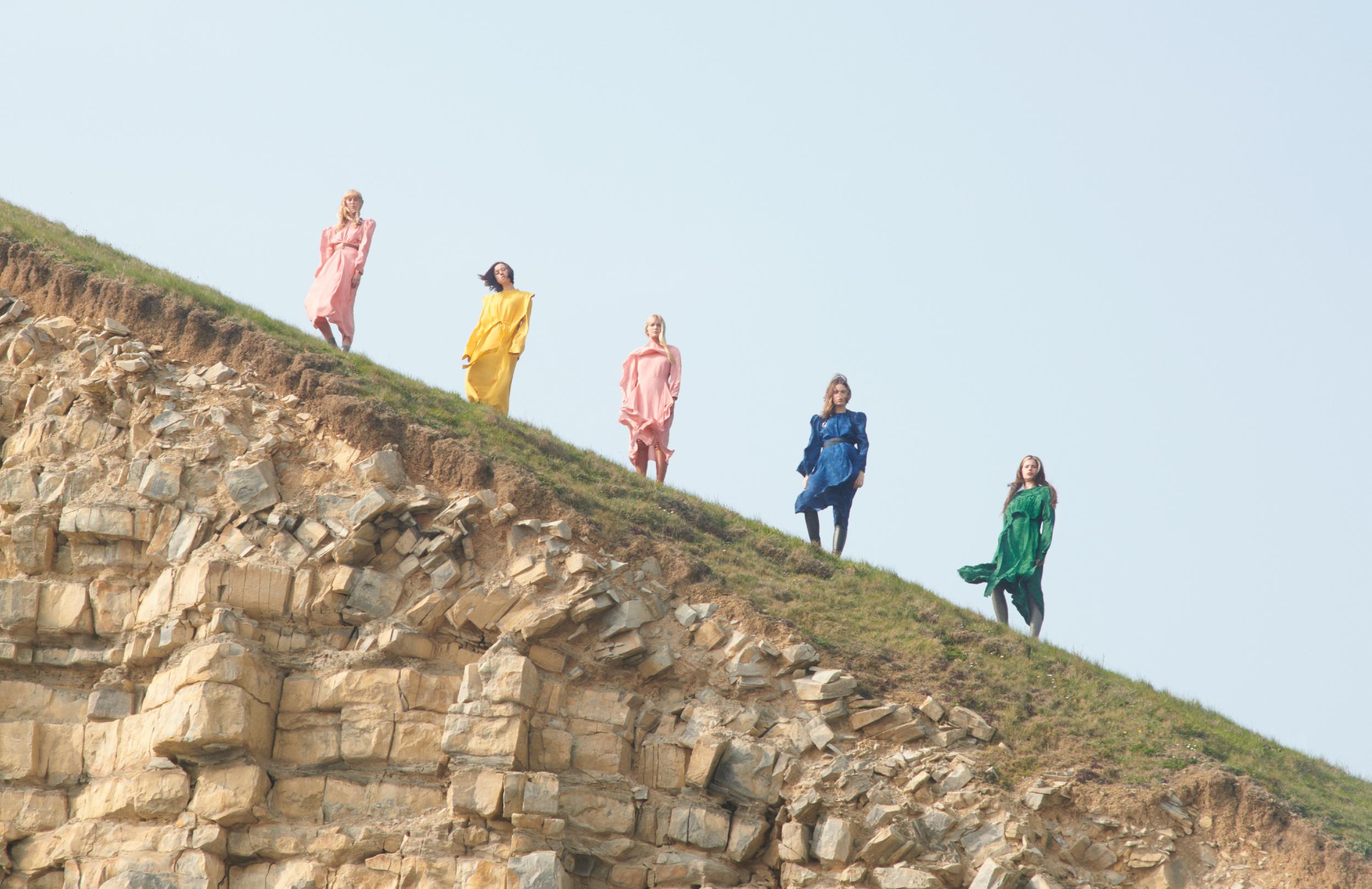 Extinction Rebellion activists pose together on a hill for the campaign