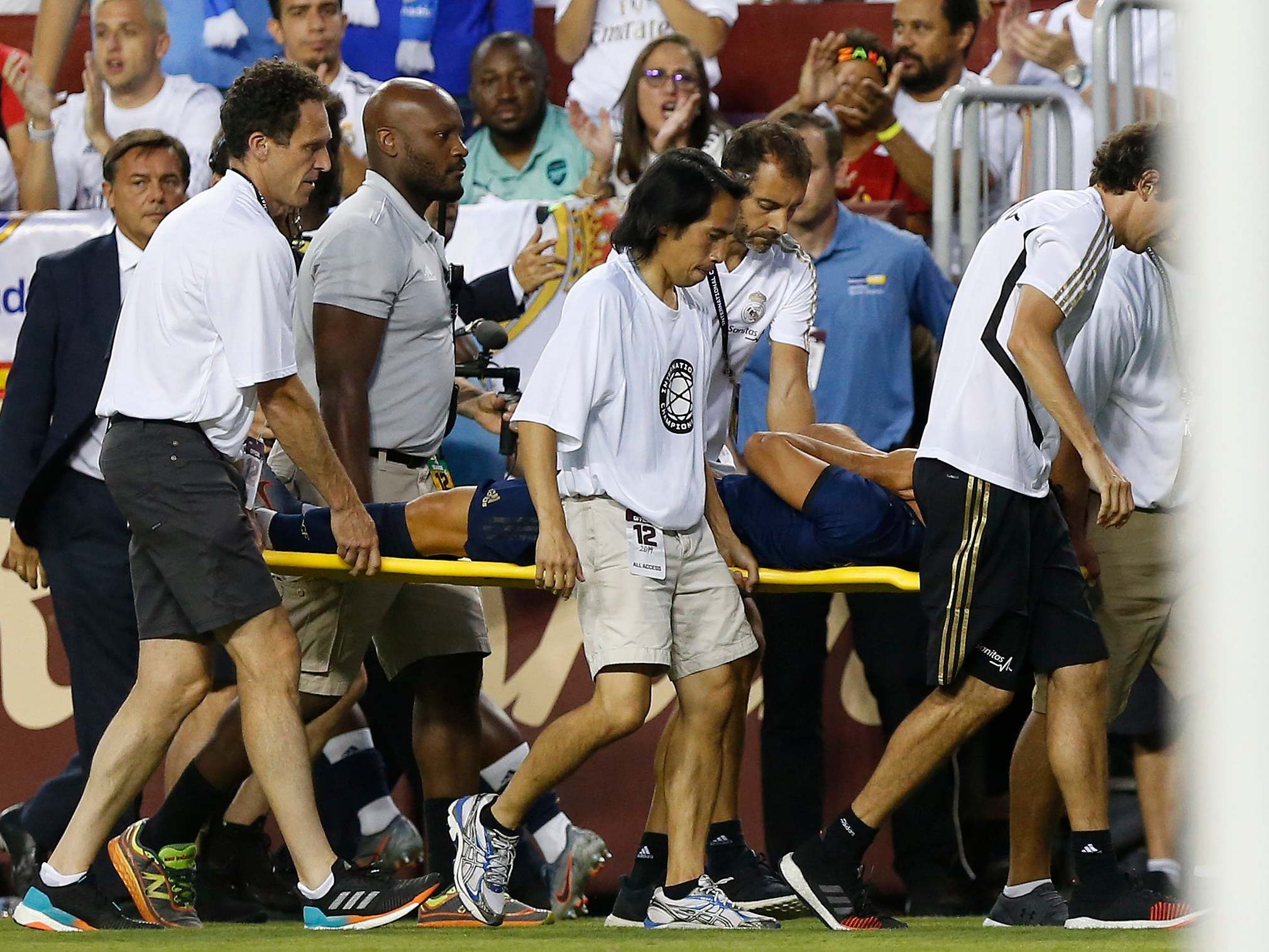 Asensio is taken off on a stretcher