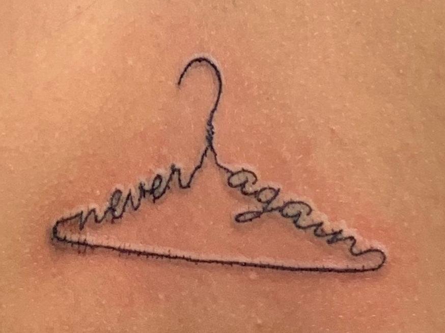 Robin Pereira had the words 'never again' engraved to represent those who she says can get drawn into underground abortions with fatal consequences