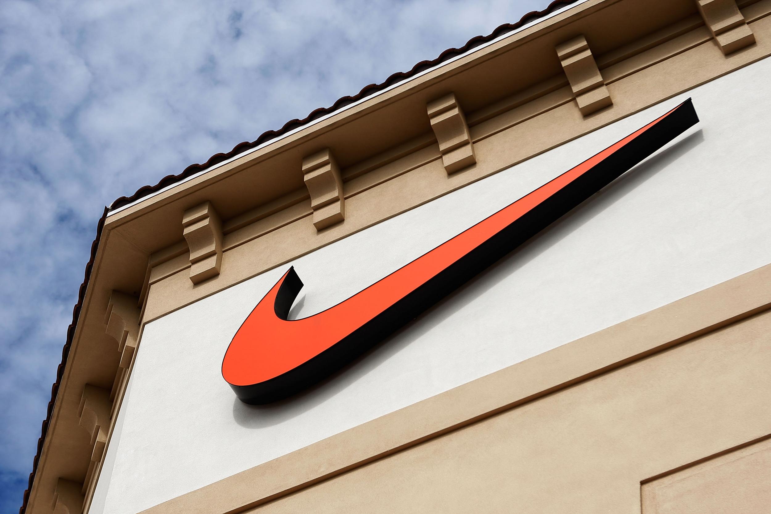 The "Swoosh" logo is seen on a Nike factory store on December 12, 2009 in Orlando, Florida.