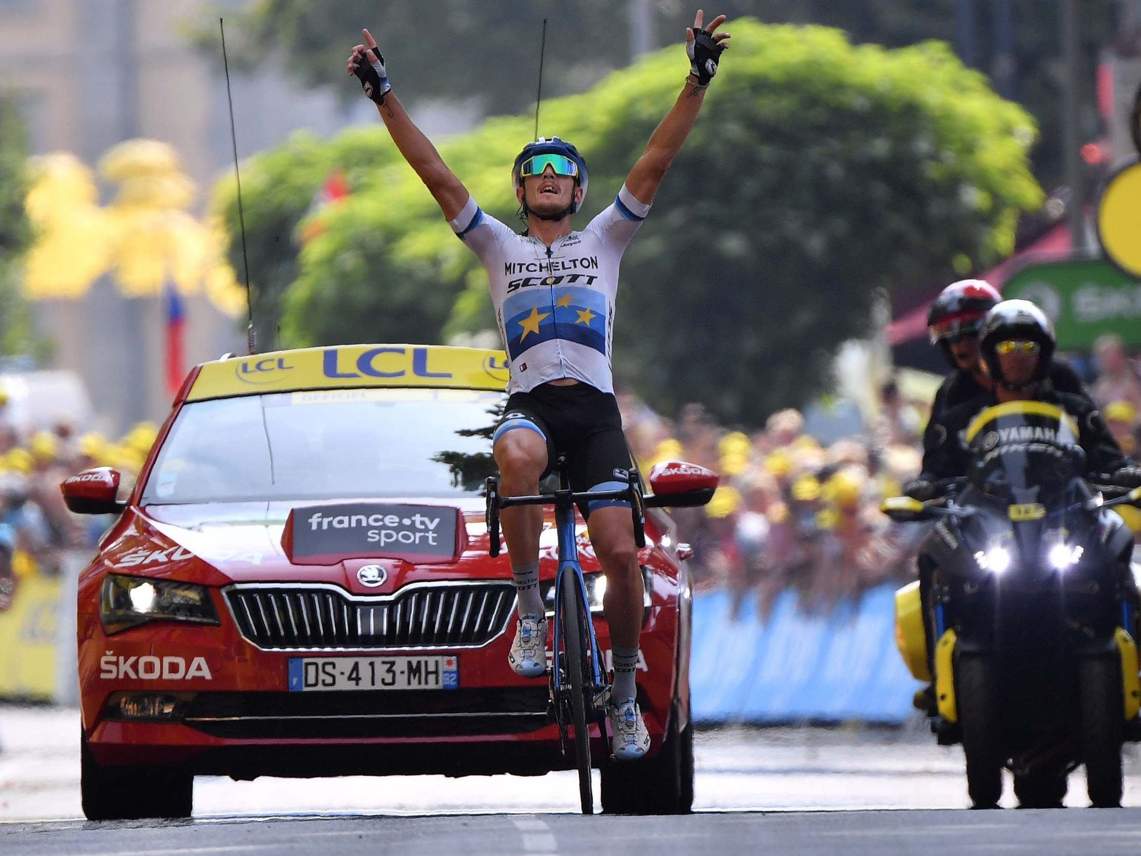 Matteo Trentin celebrates as he crosses the finish line