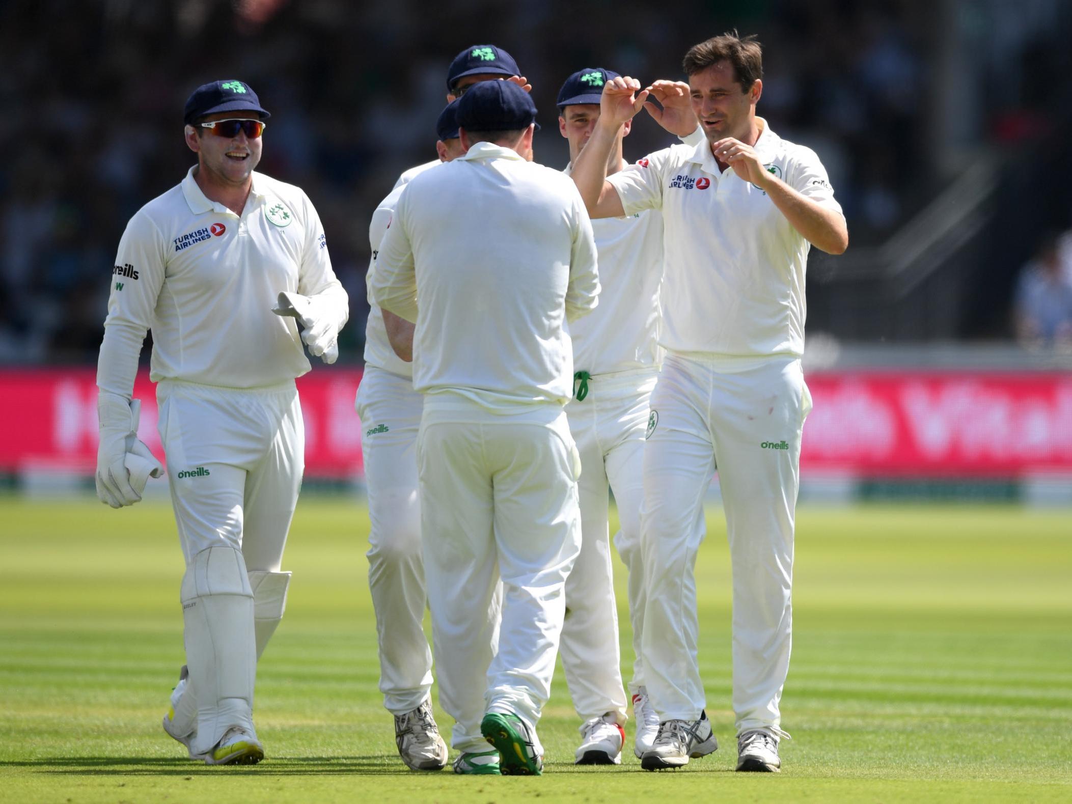 Tim Murtagh celebrates with teammates after dismissing Jason Roy