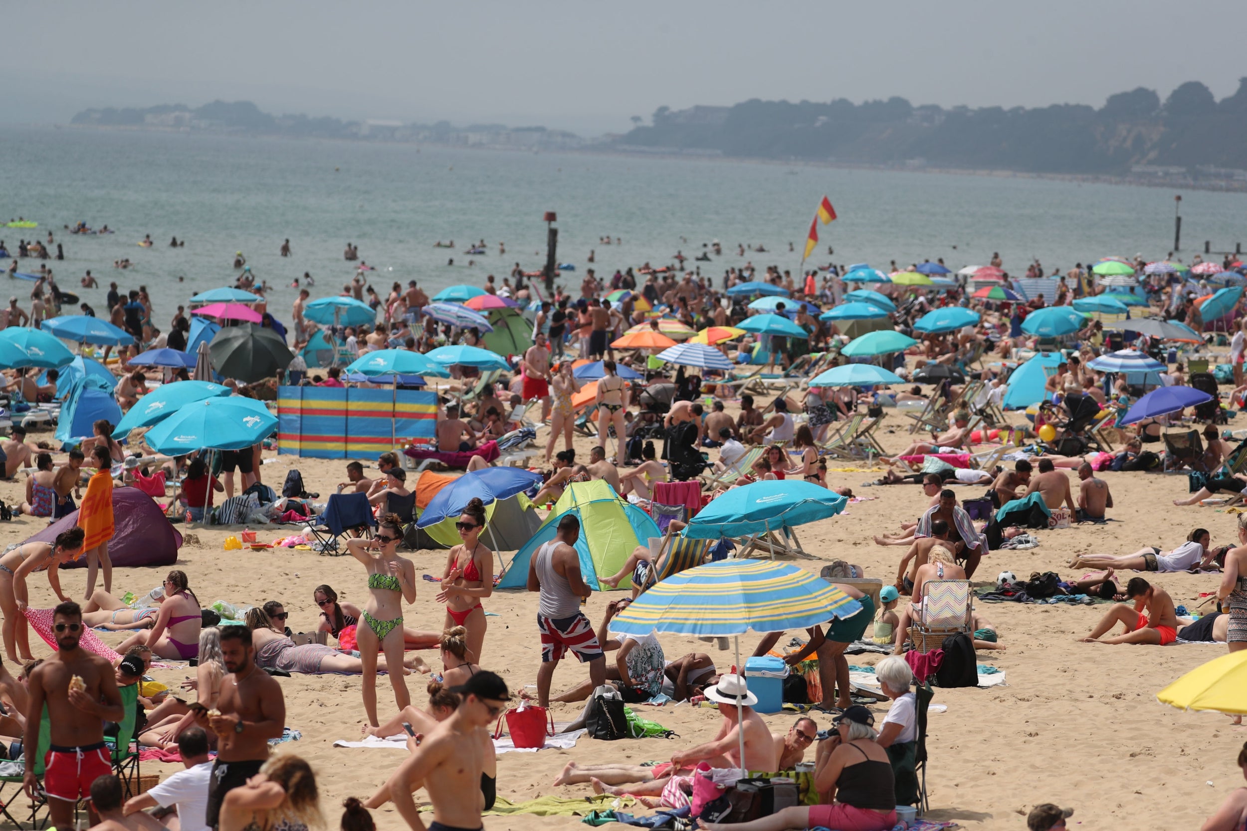 Hundreds of people at the beach in Bournemouth, as the UK could encounter the hottest July day on record