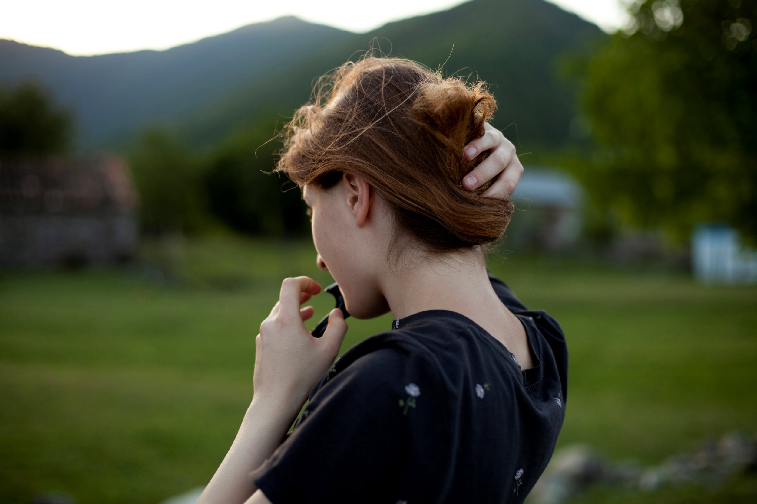 Mariam Kebadze, 16, fixes her hair during an evening walk along Alazani river. Mariam used to live with her father in Telavi and moved to Pankisi to support her mother. "It's really boring sometimes here, there's not much to do in the village because it's the same routine all the time - school, classes, jogging by the river sometimes," she said.