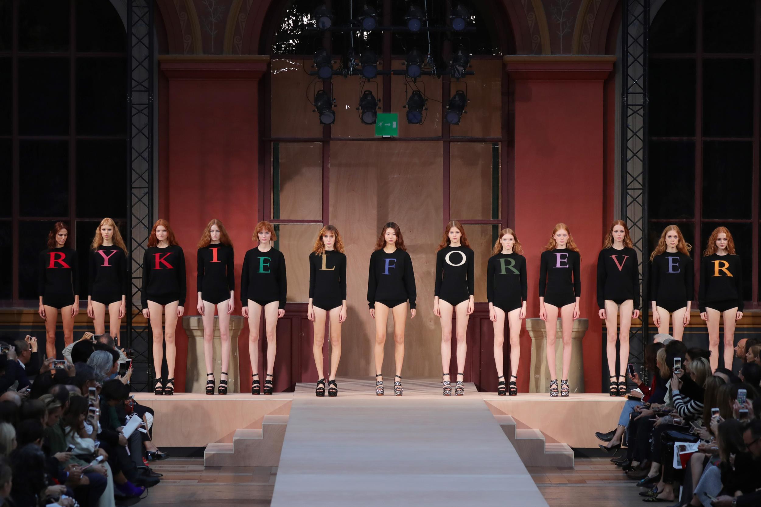 Following the death of the designer in 2016, the brand paid tribute to her at its spring/summer 2017 runway show. Red-haired models stormed the catwalk wearing black jumpers with letters spelling the slogan “Rykiel Forever”. The collection, designed by the label's artistic director Julie de Libran, took inspiration from Rykiel’s early designs. Models wore hats and multi-coloured striped knitwear which was made famous by the likes of Brigitte Bardot and Audrey Hepburn during the 1960s and 1970s.