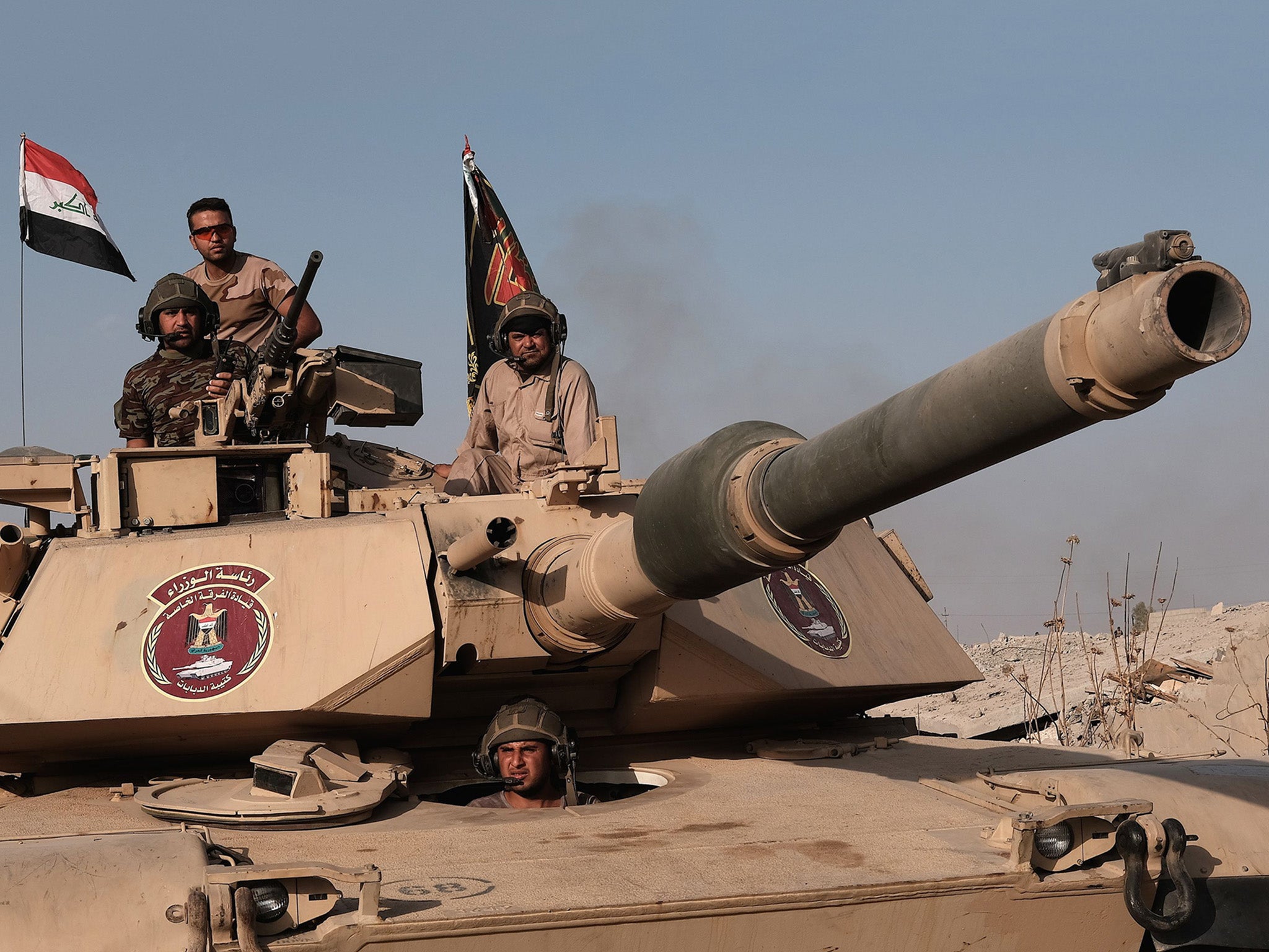 Golden Division specialists roll into a village liberated from Isis in the battle for Mosul, in Iraq, in 2016