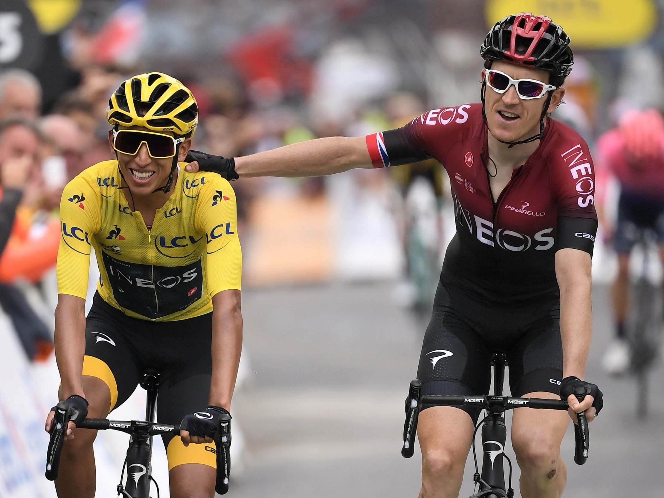 Geraint Thomas pats his team-mate Egan Bernal on the back at the finish