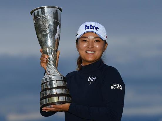 The South Korean poses with the trophy