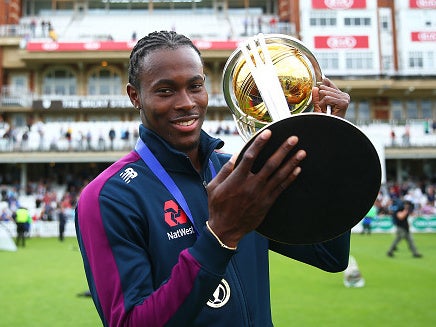 Jofra Arches celebrates with the World Cup trophy