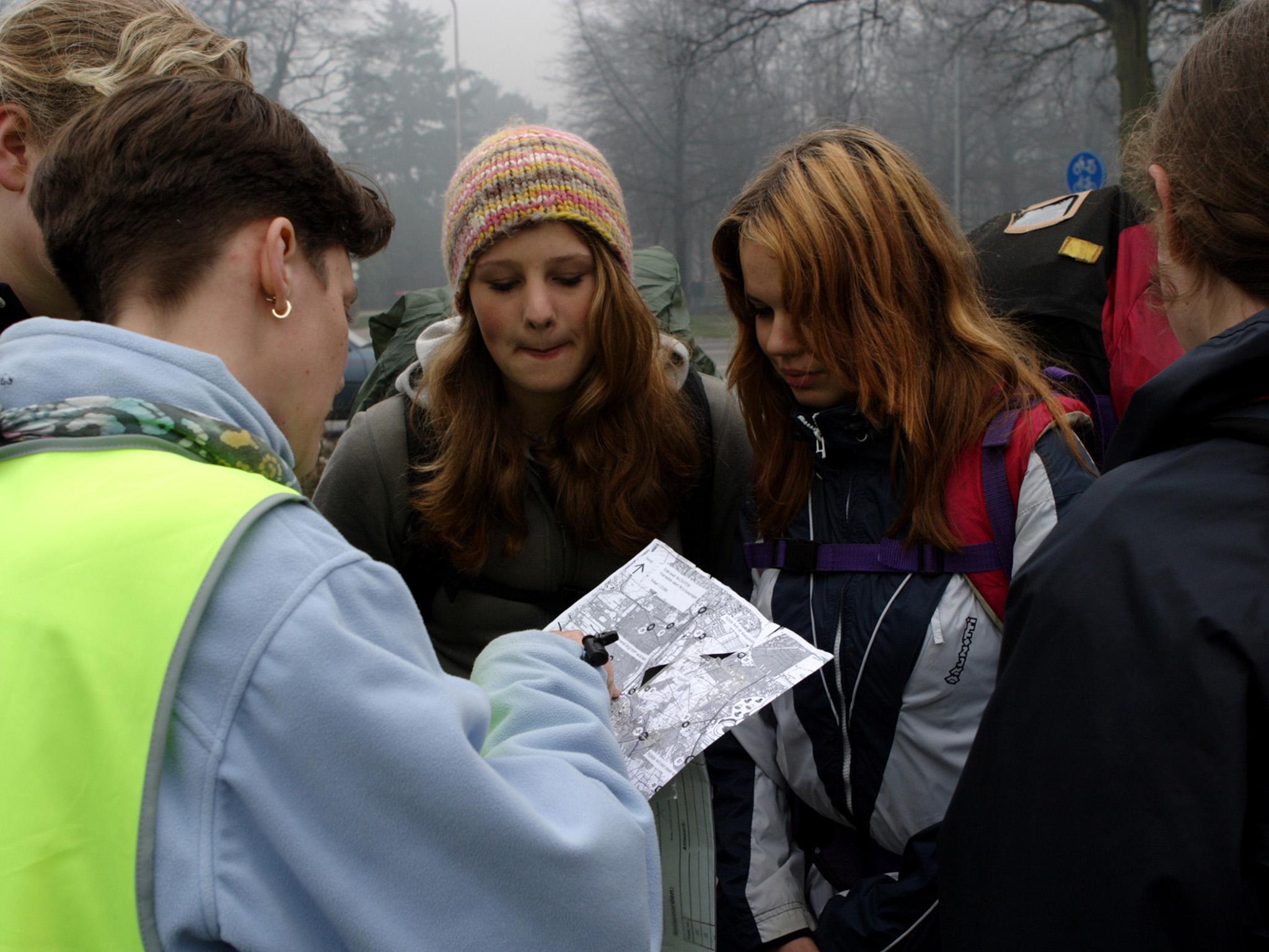 Dutch Scouts consult a map: ‘Of course, you make sure they don’t die, but other than that, they have to find their own way’