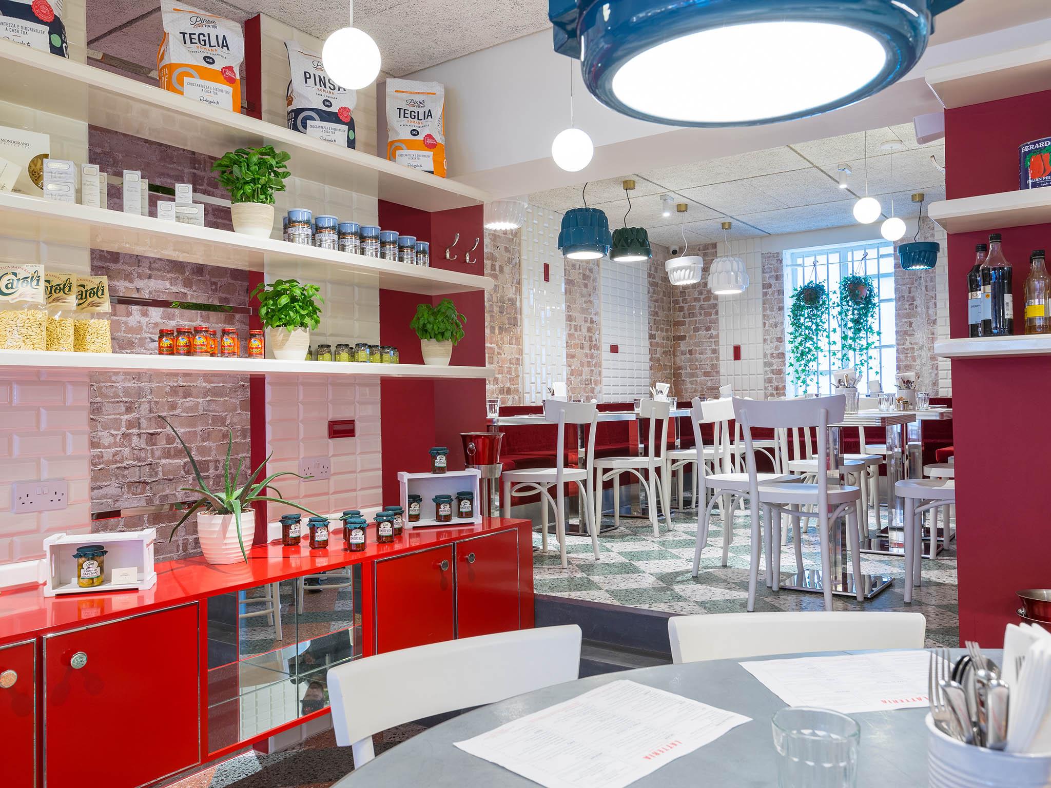 With exposed brick, white tiles and red booth style seating, the interior is a mixture of American diner and Italian cafe