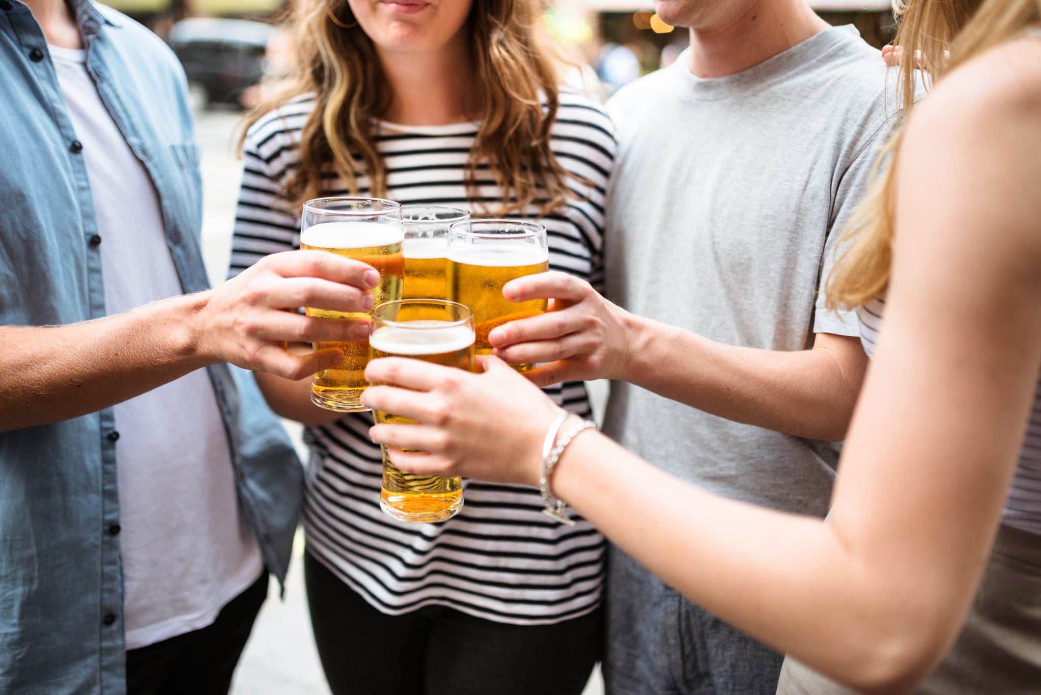 Group of friends toasting with drinks for the oktoberfest