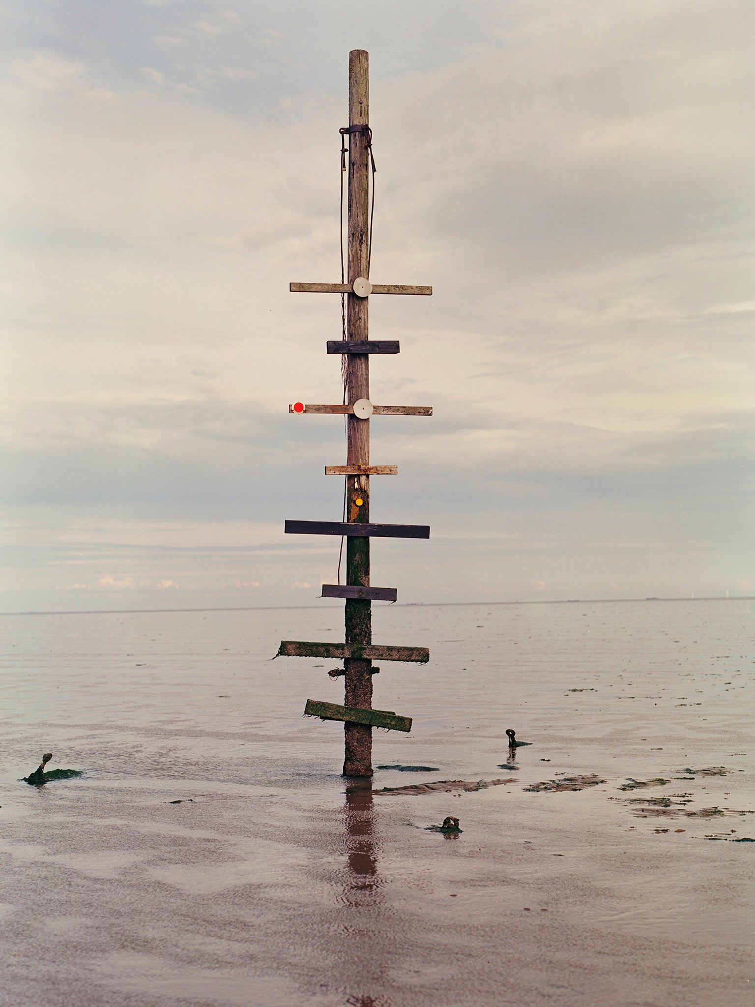 At the first waypoint of the walk along the Broomway path in England is an old telegraph pole (Tori Ferenc/Washington Post)