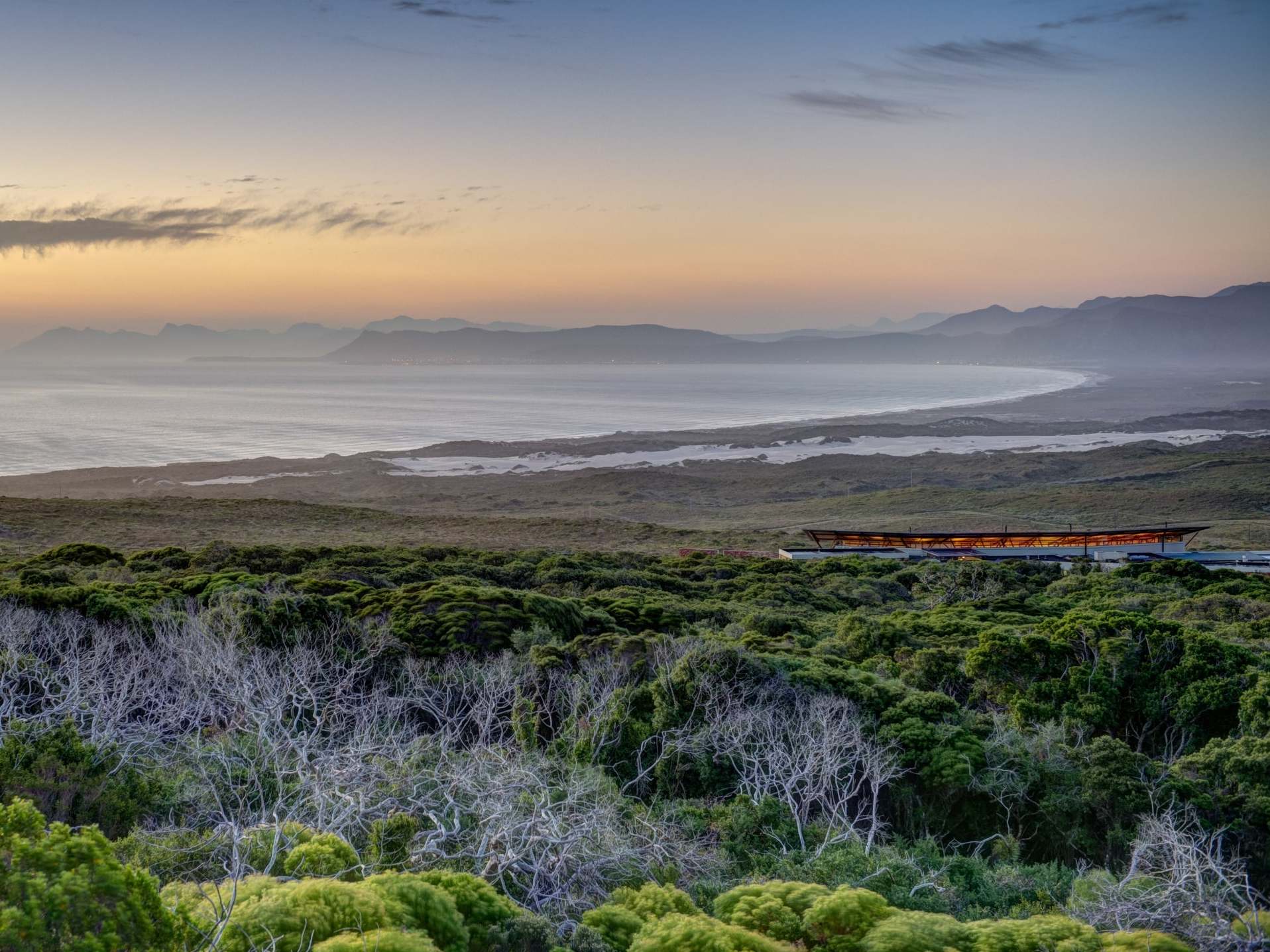 The reserve is surrounded by lush greenery and the sea