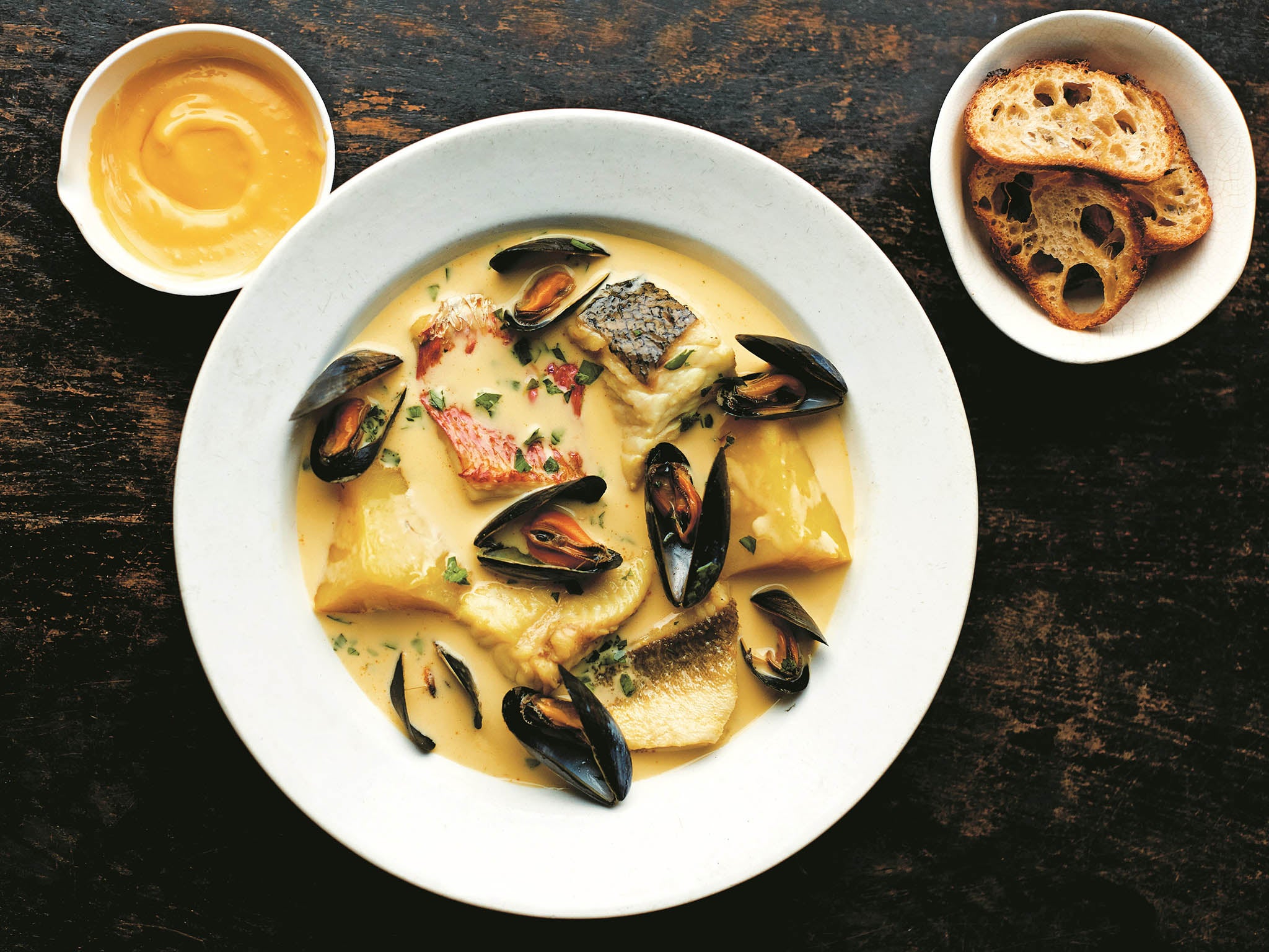 A cousin of bouillabaisse, bourride is a rich, saffron-spiked fish stew thickened with aïoli