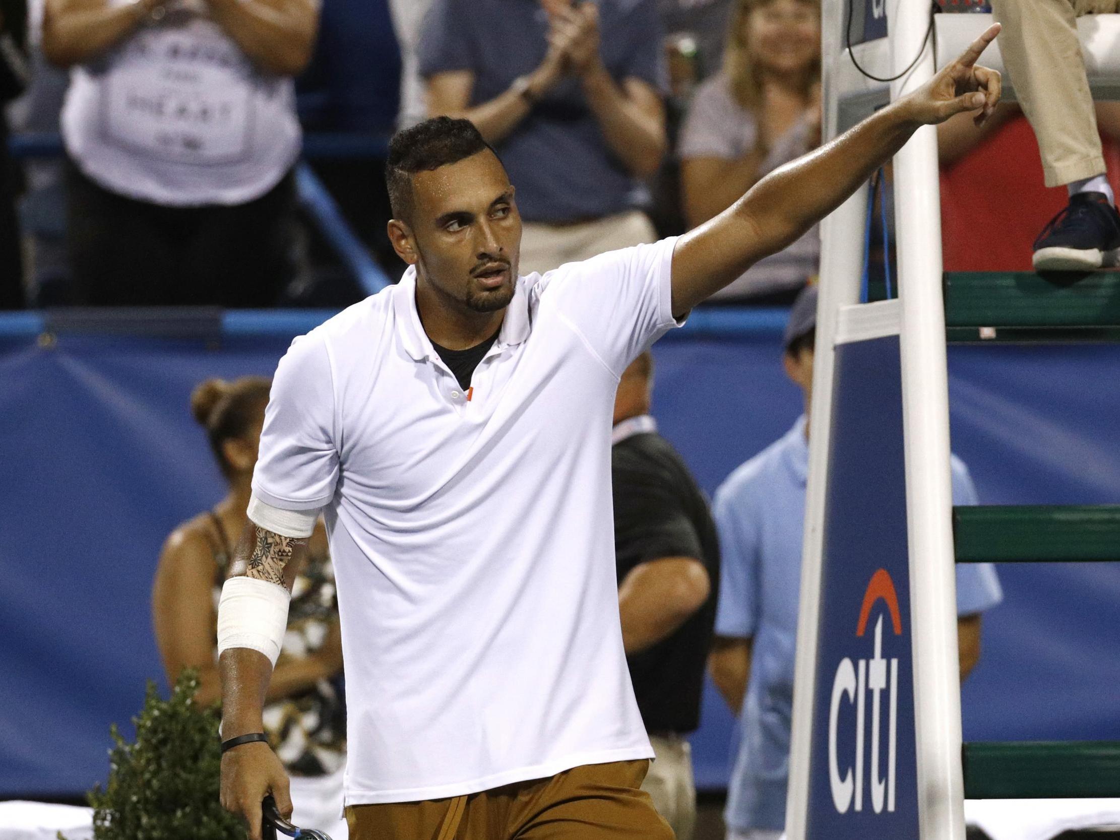 Nick Kyrgios celebrates after beating Stefanos Tsitsipas