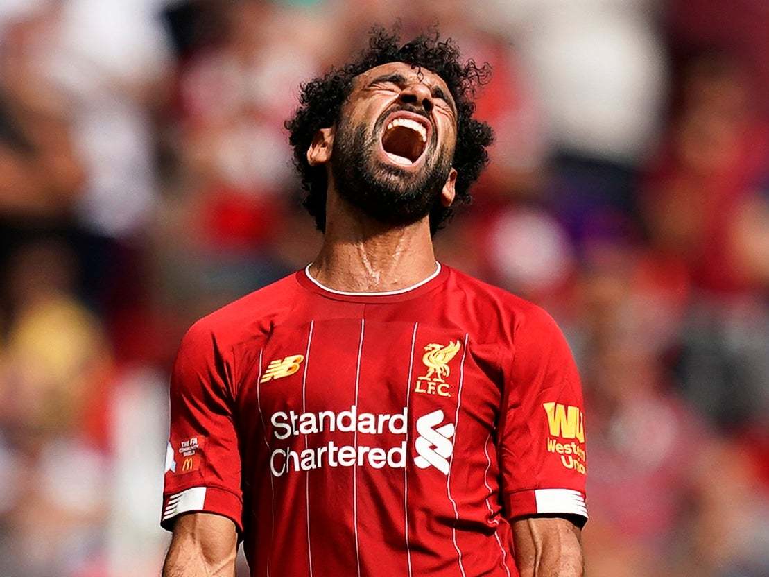 Salah reacts after missing a chance vs City