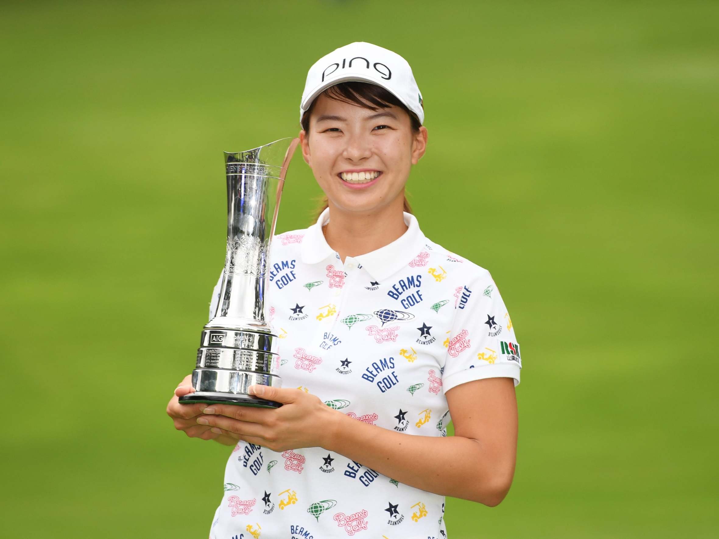 The 20-year-old celebrates with the trophy