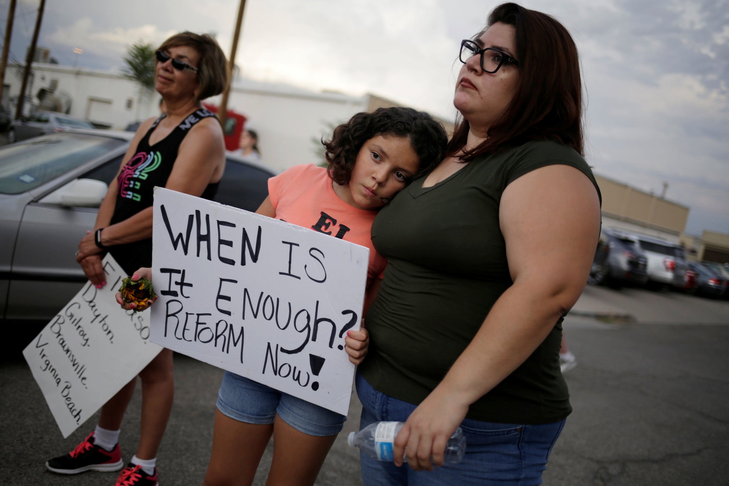 Families gather at the scene of the El Paso shooting as a chorus of calls for a US gun control clampdown grow louder