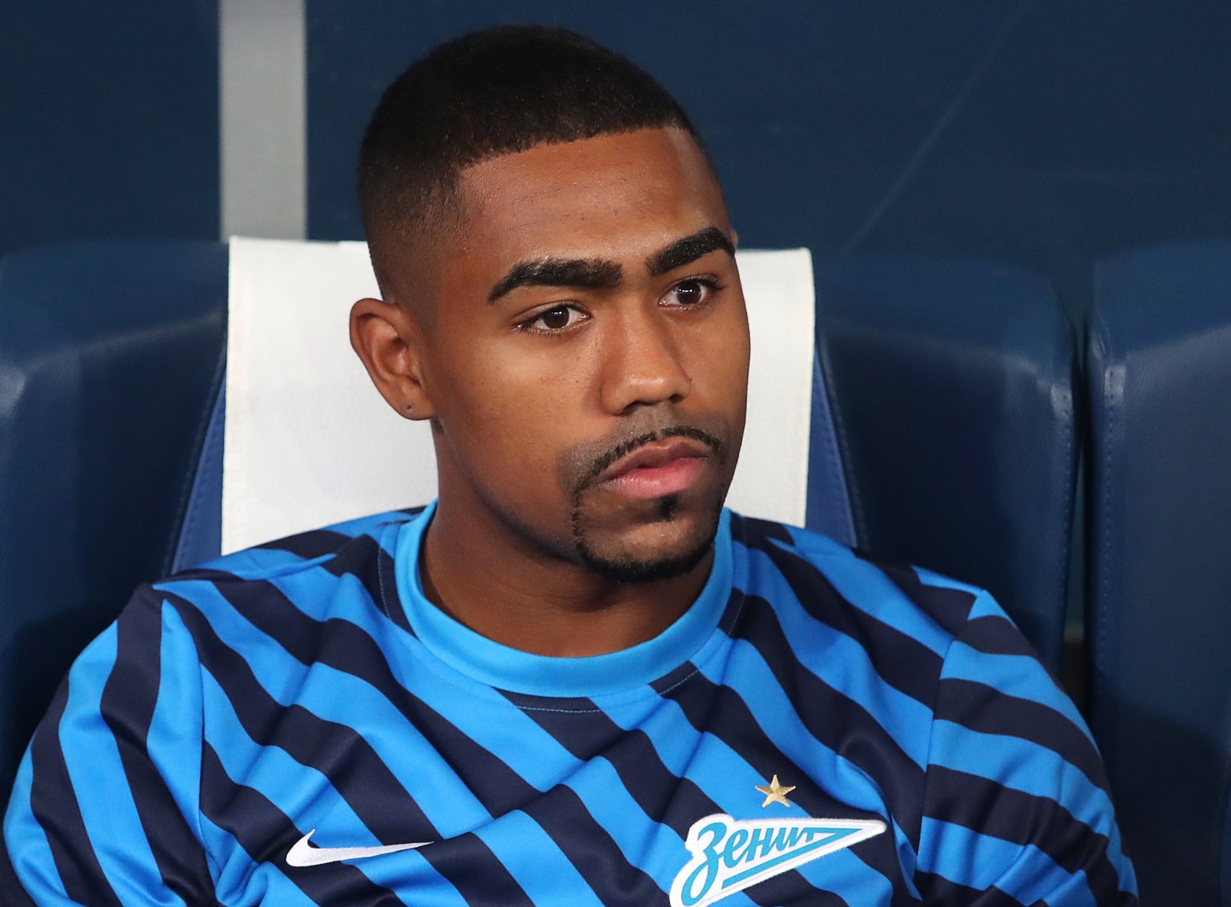 Malcom sits on the bench ahead of his debut against Krasnodar