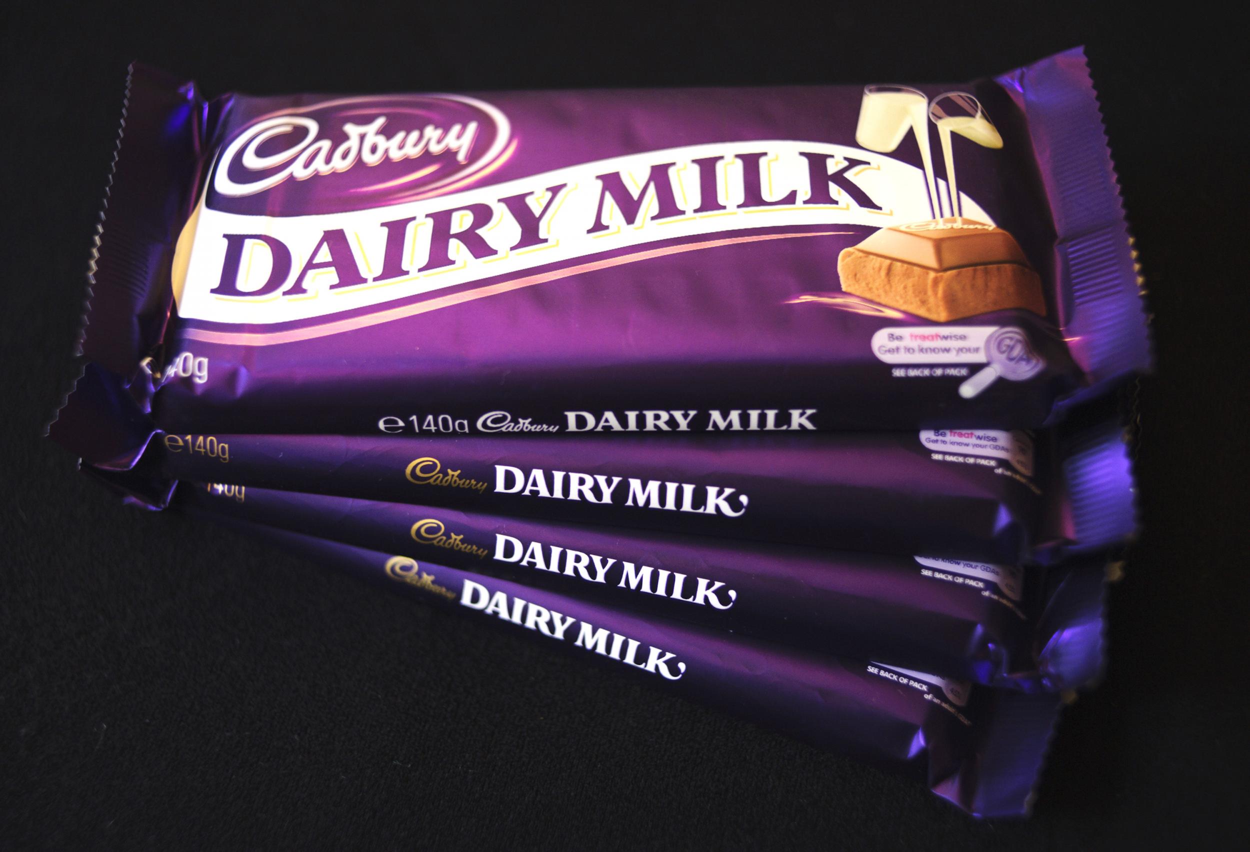 Cadbury's Dairy Milk chocolate bars sit arranged for a photo at a store in London, U.K., on Monday, Nov. 9, 2009