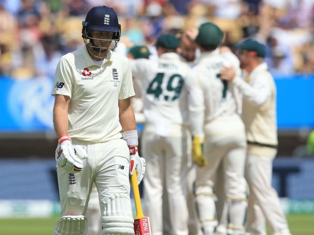 England's captain Joe Root walks back to the pavilion