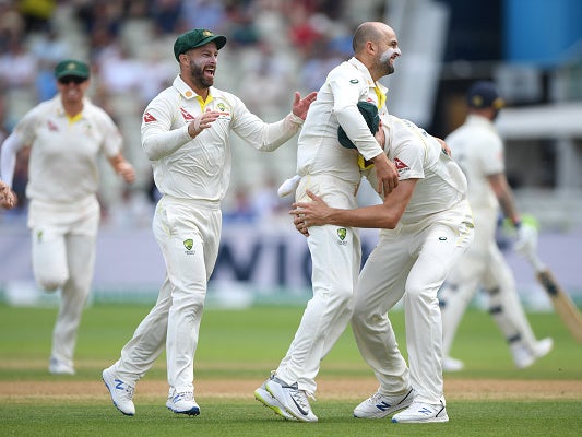 Nathan Lyon is congratulated by his teammates