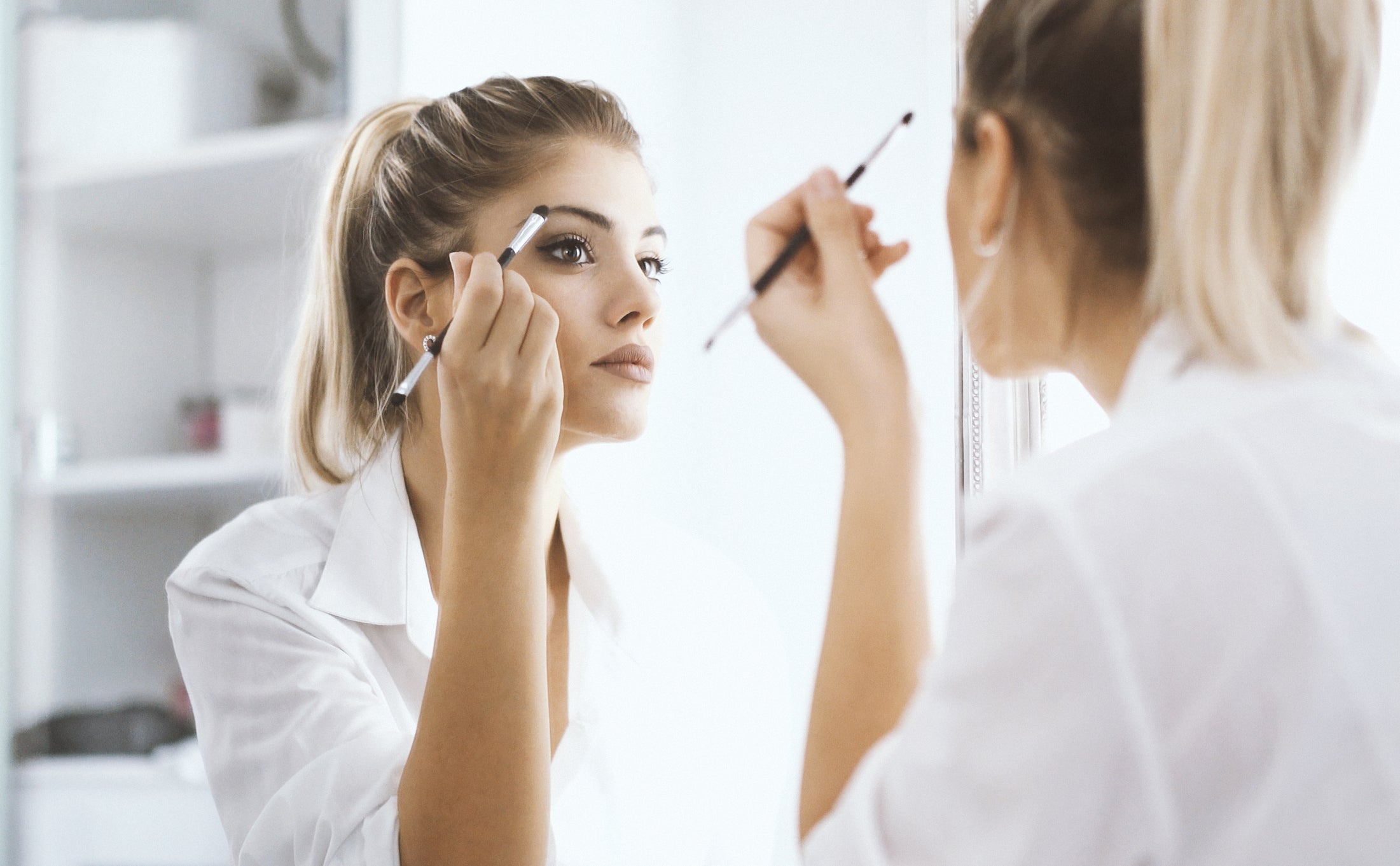 Woman applying eyeshadow