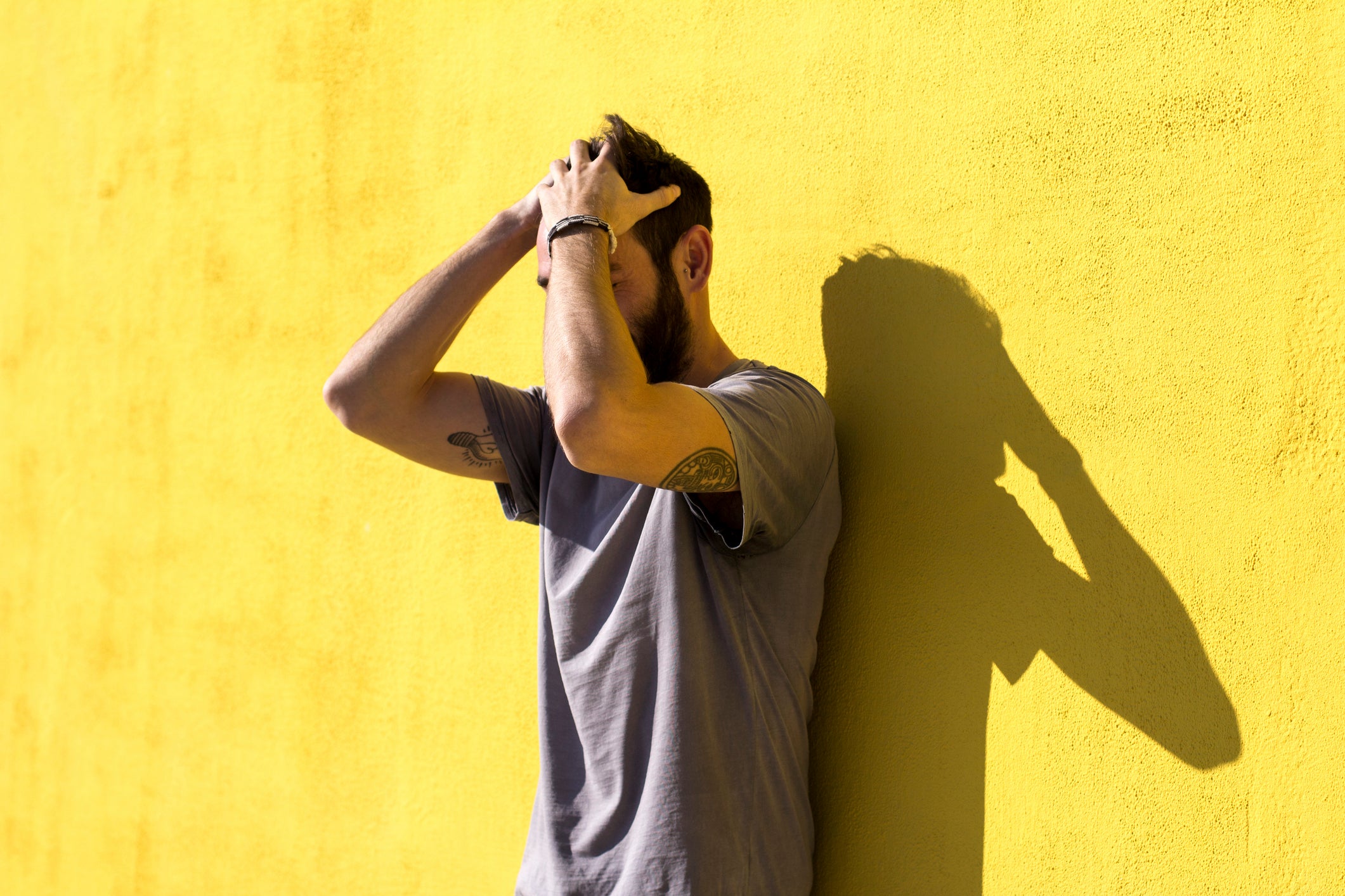 Young man combing his hair