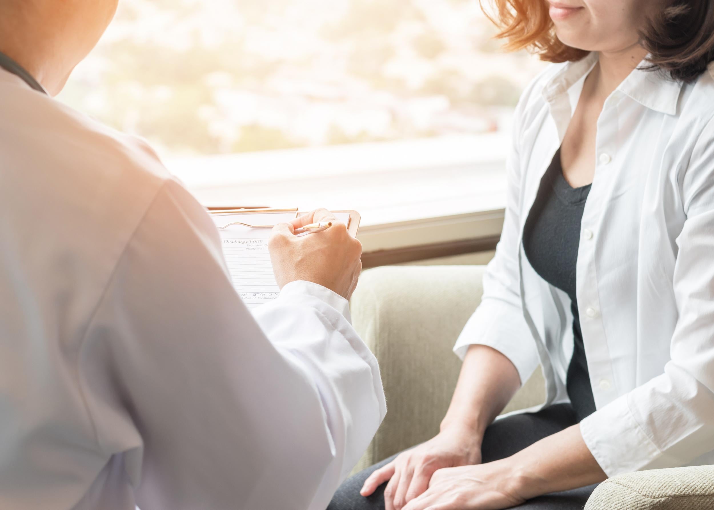 Woman speaking to doctor